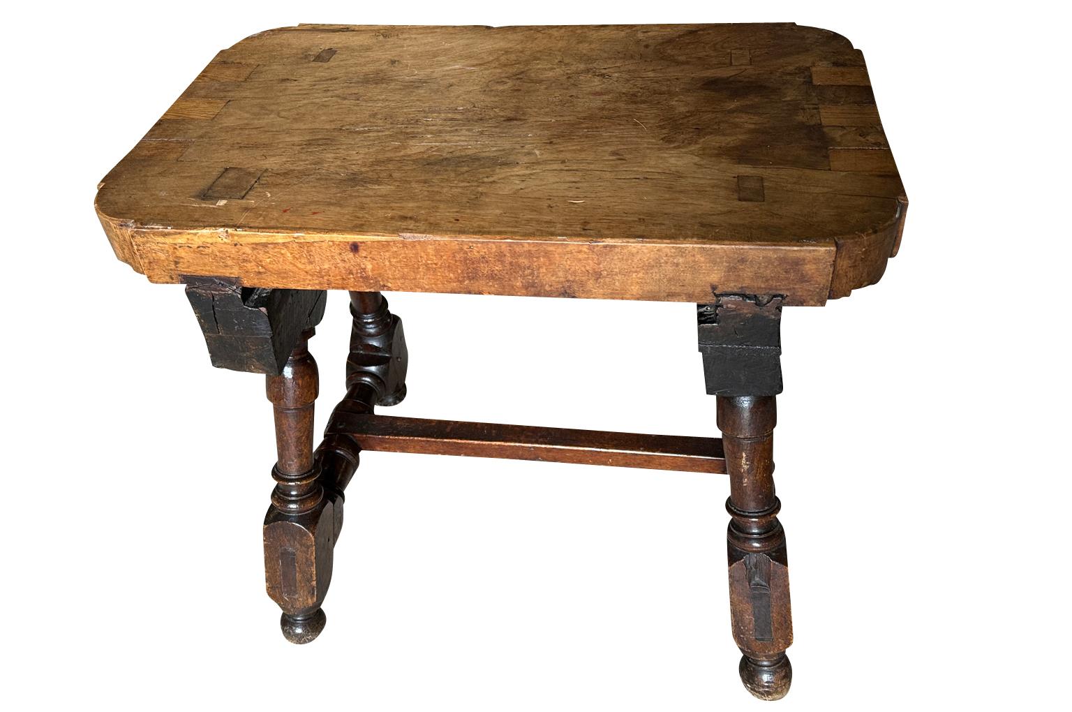 Fabulous 18th century Tocinera Side Table from Spain.  Tocineras were used in the kitchens for salting pork, bacon - tocina.  Beautifully constructed from walnut with handsome turned legs.  A terrific side table perfect for any traditional or modern