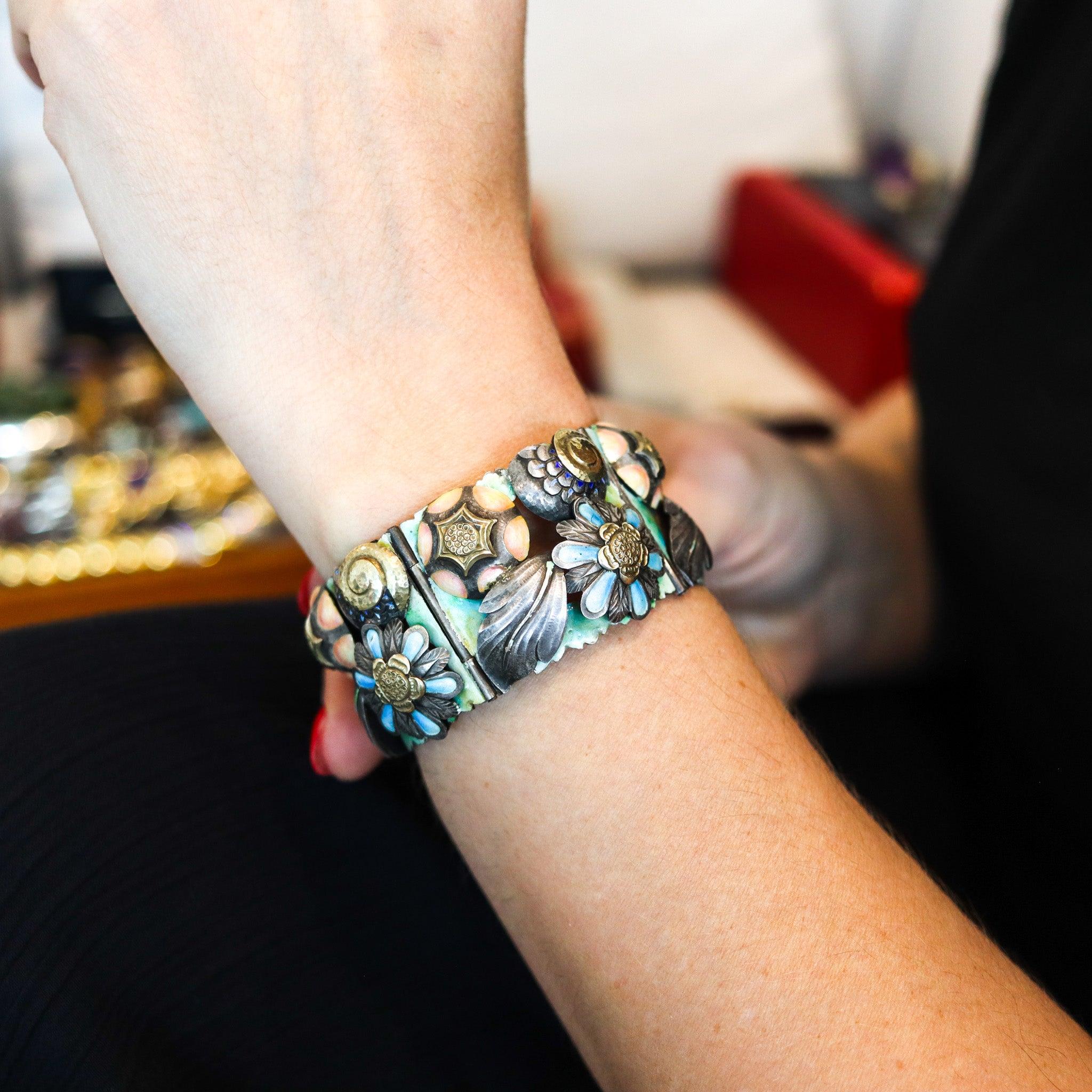 A rare art-nouveau aesthetic bracelet made in Barcelona.

This is a very rare highly decorated bracelet, created in Barcelona Spain during the art-nouveau period, back in the 1900. This Catalonian bracelet was designed with fantastic Noucentisme