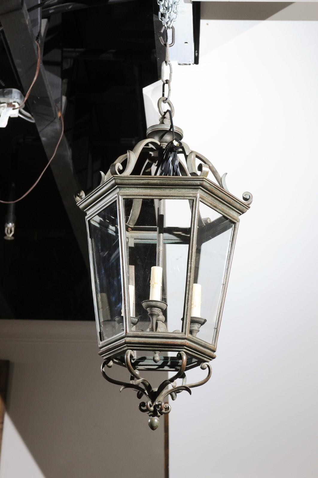 Spanish 1910s Bronze and Glass Hexagonal Lantern with Three Lights and Volutes In Good Condition For Sale In Atlanta, GA