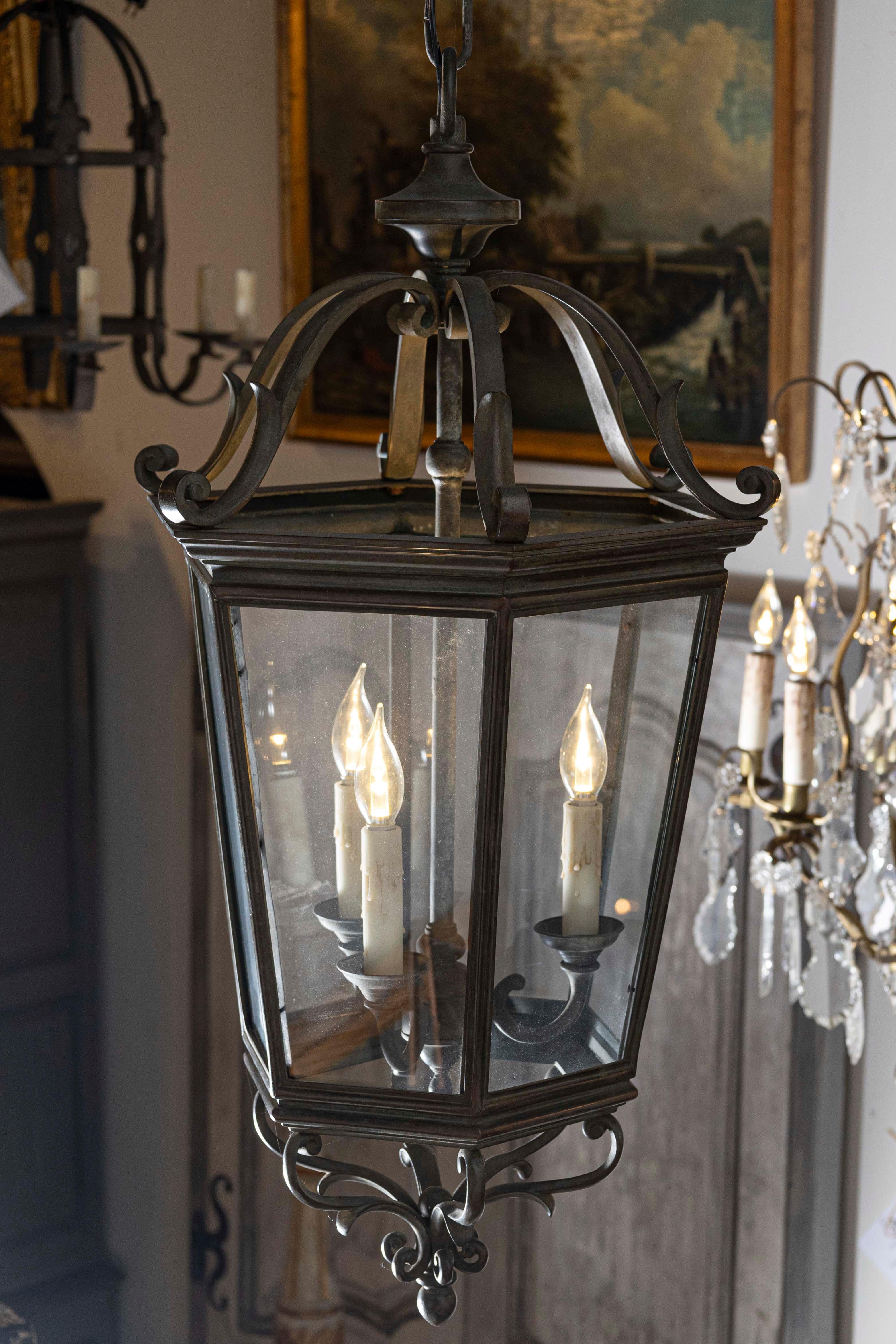 Spanish 1910s Bronze and Glass Hexagonal Lantern with Three Lights and Volutes In Good Condition For Sale In Atlanta, GA