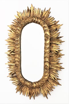 Spanish 1930s Baroque Style Carved Giltwood Oval Shaped Sunburst Mirror