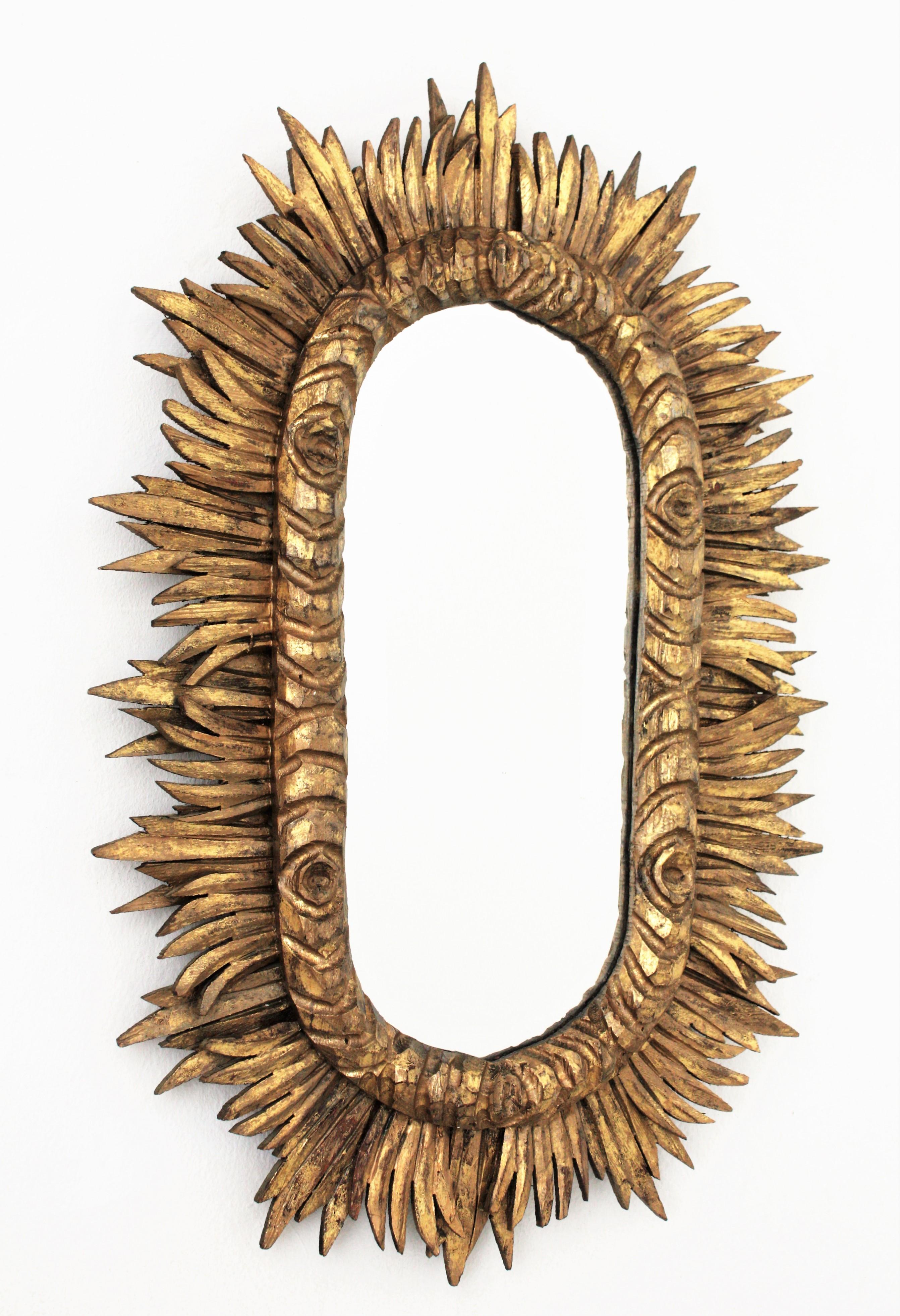 Hand-Carved Spanish 1930s Baroque Style Carved Giltwood Oval Shaped Sunburst Mirror