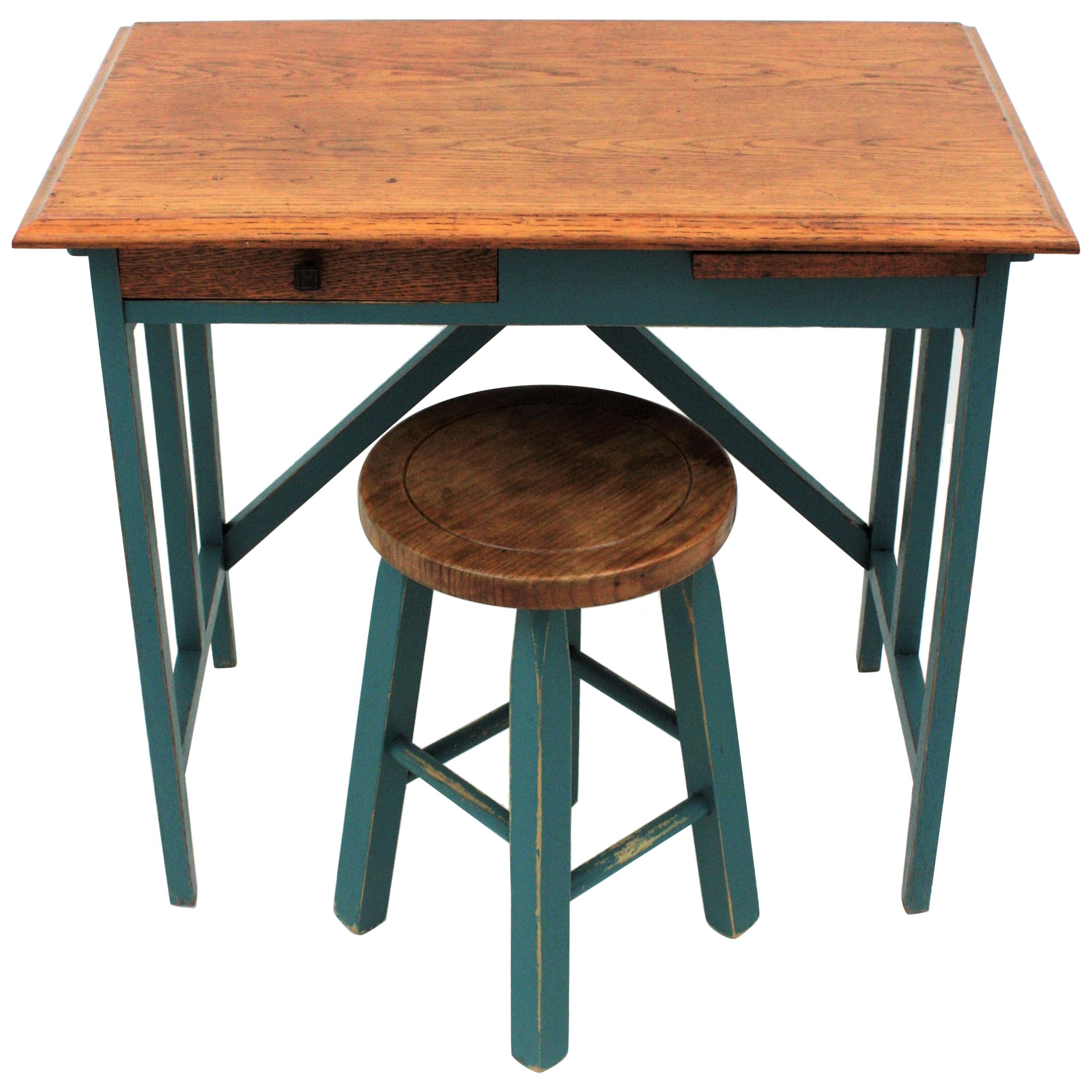 Industrial Desk and Stool, Oak, Spain, 1930s
A lovely set composed by an industrial desk with Art Deco accents patinated in Jade green-blue color with the top in oakwood.
The small stool is made of pine wood combining the same color.
This set will