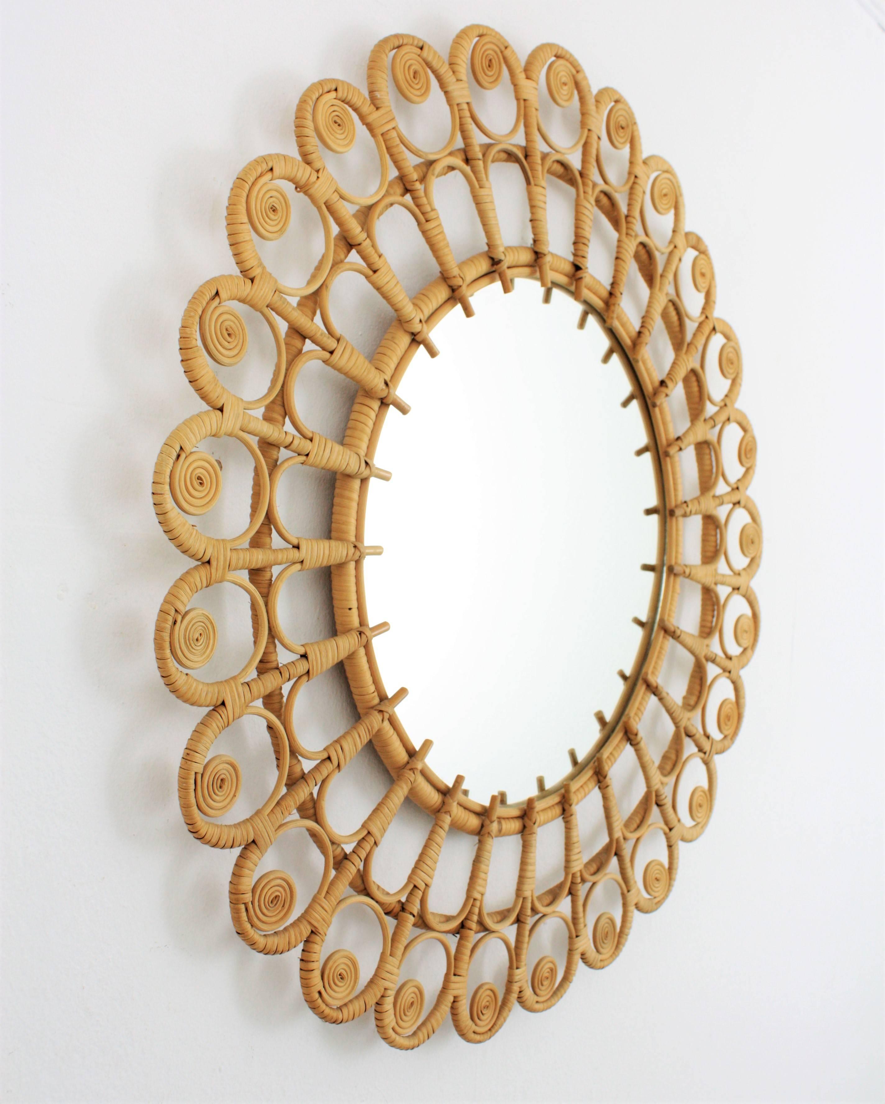 Lovely handcrafted wicker mirror with a beautiful artistic filigree frame. This mirror has all the taste of the Mediterranean and Bohemian style. Handmade in wicker and rattan with natural finish without varnish. Beautiful placing it alone or placed