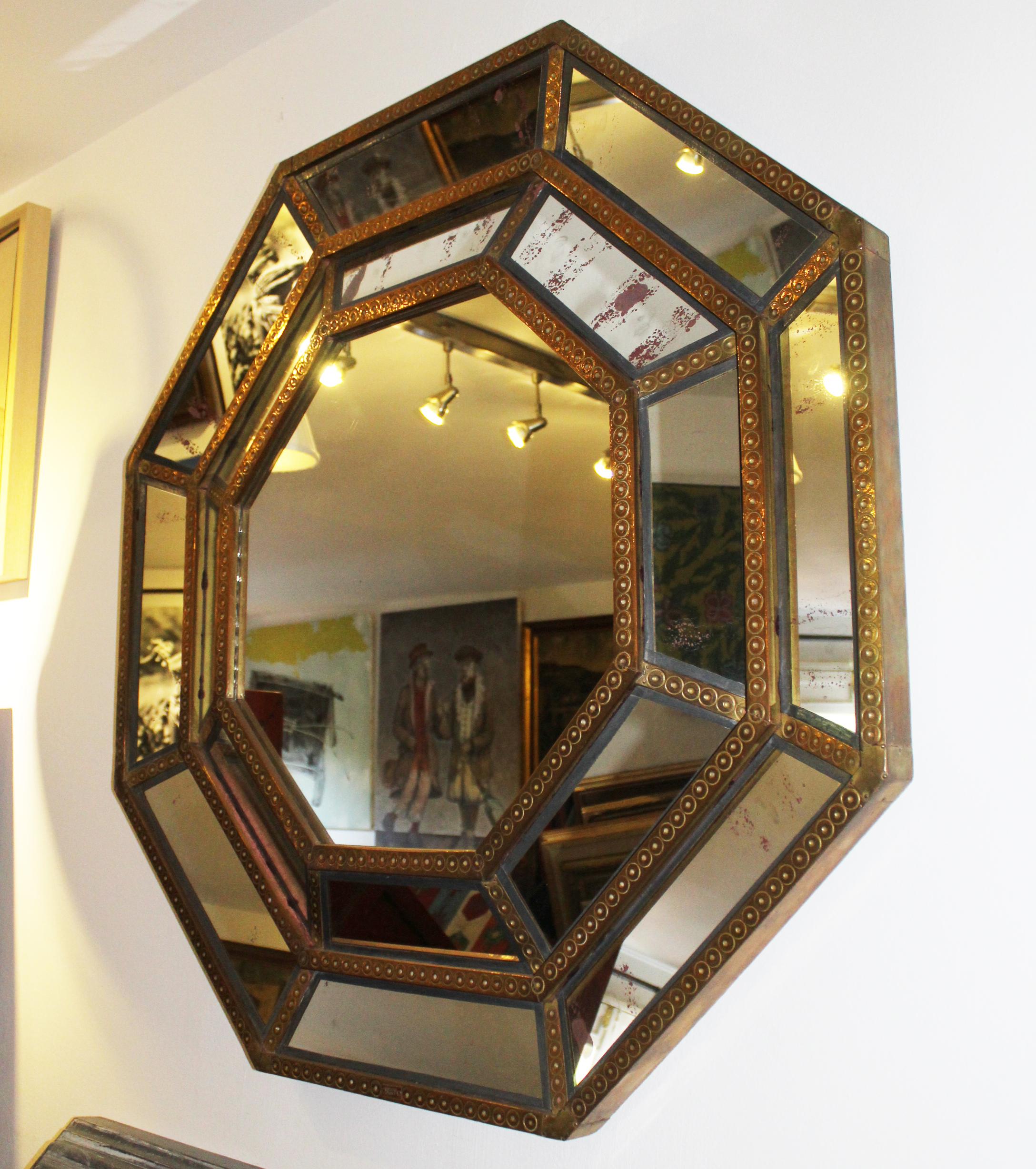 Spanish, 1980s Bedoya Arte signed octagonal mirror
Elegant handcrafted octagonal bronze on wood mirror with circular decorations.
  
