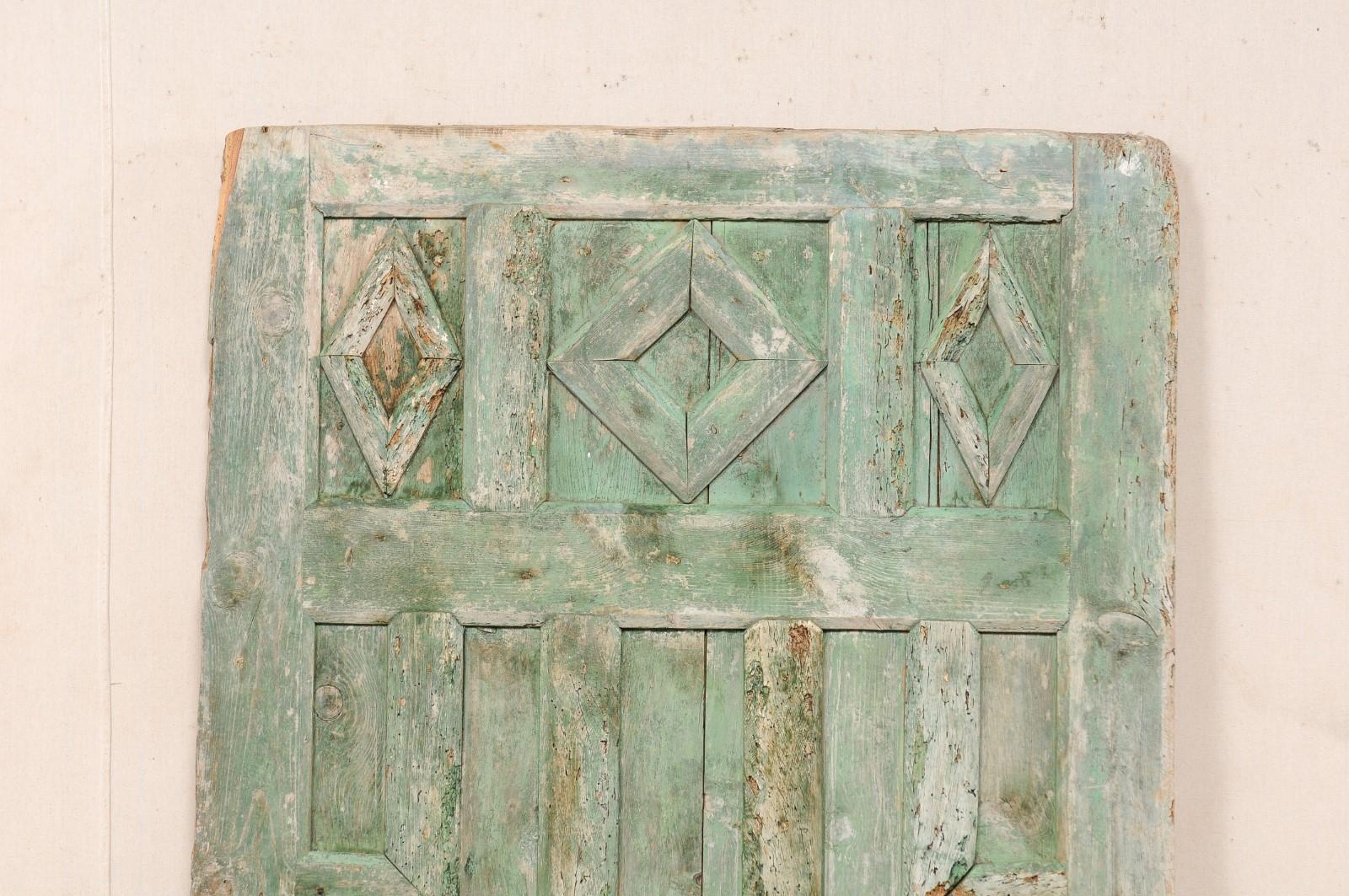 Spanish 19th Century Geometric Paneled Door with Its Original Green Paint In Good Condition For Sale In Atlanta, GA