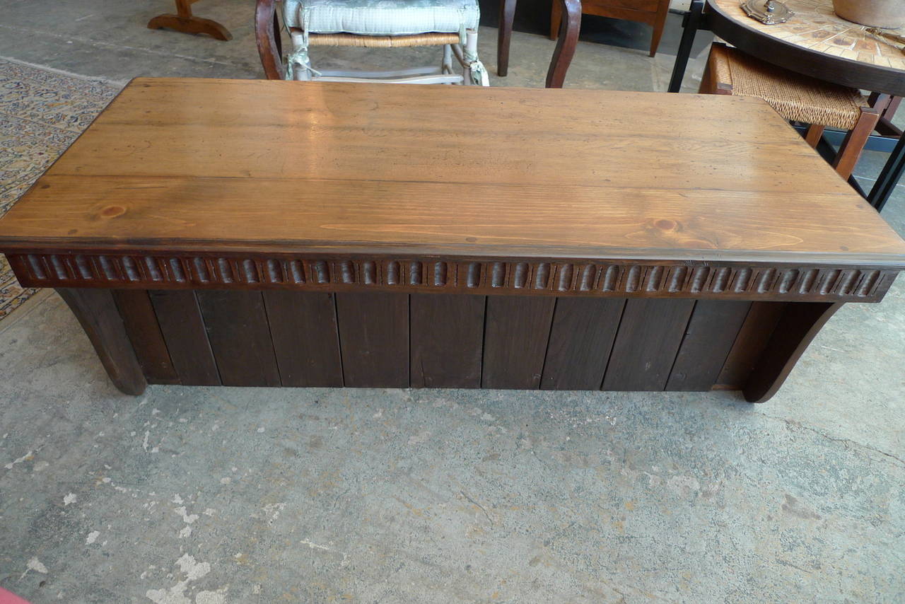 Spanish 19th century carved walnut coffee table with small storage compartment.