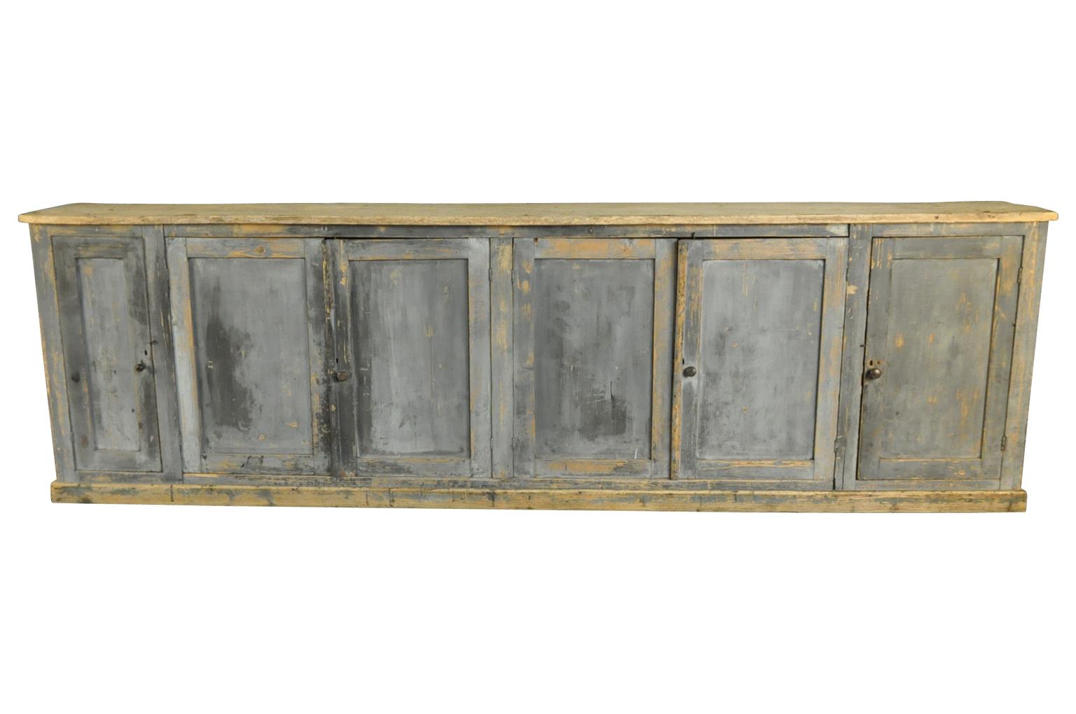 A very handsome later 19th century Enfilade - Buffet from the Catalan region of Spain. Soundly constructed from painted wood with 6 doors and interior shelving. Terrific patina. Wonderful narrow depth.