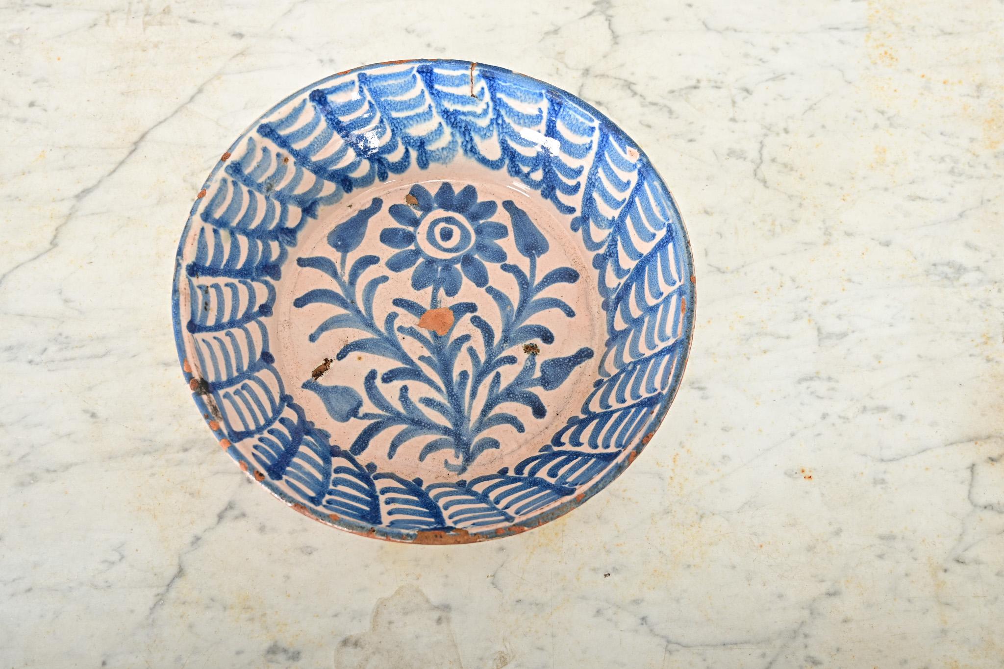 A charming, handpainted terracotta lebrillo bowl from Granada, Spain (19th century)–these illustrative ceramic works collectively known as fajalauza pottery can be traced back to at least the 16th century, deeply influenced by the Moorish presence