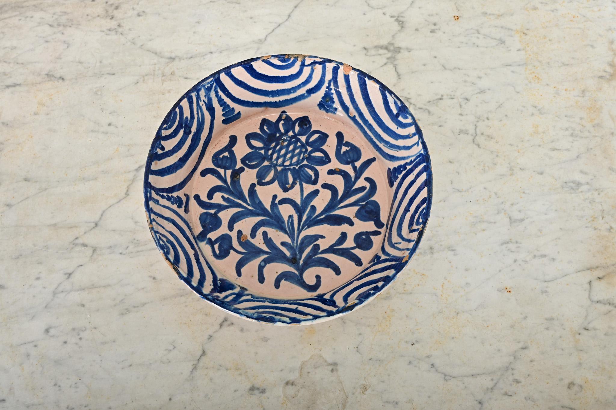 A charming, handpainted terracotta lebrillo bowl from Granada, Spain (19th century)–these illustrative ceramic works collectively known as fajalauza pottery can be traced back to at least the 16th century, deeply influenced by the Moorish presence