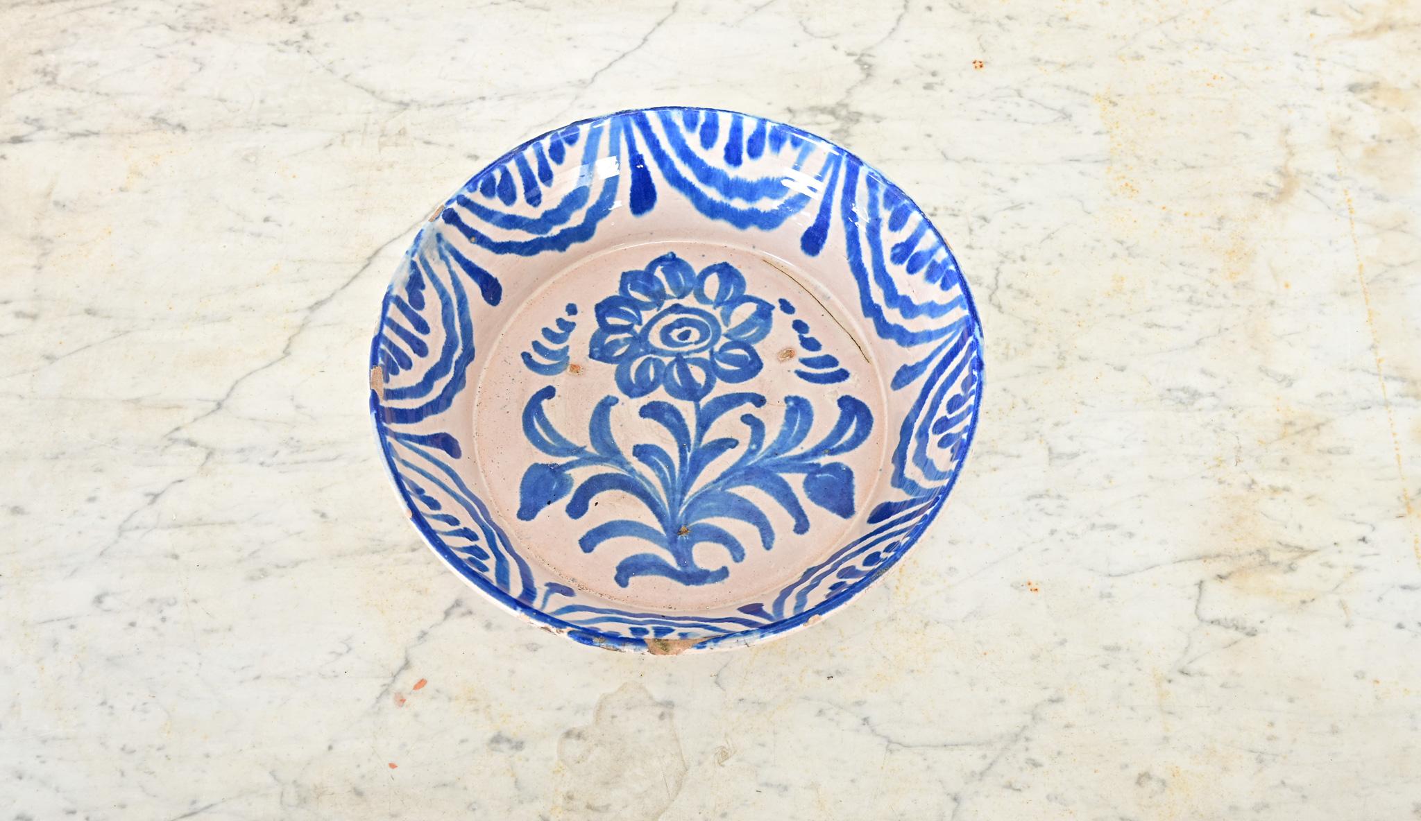 A charming, handpainted terracotta lebrillo bowl from Granada, Spain (19th century)–these illustrative ceramic works collectively known as fajalauza pottery can be traced back to at least the 16th century, deeply influenced by the Moorish presence