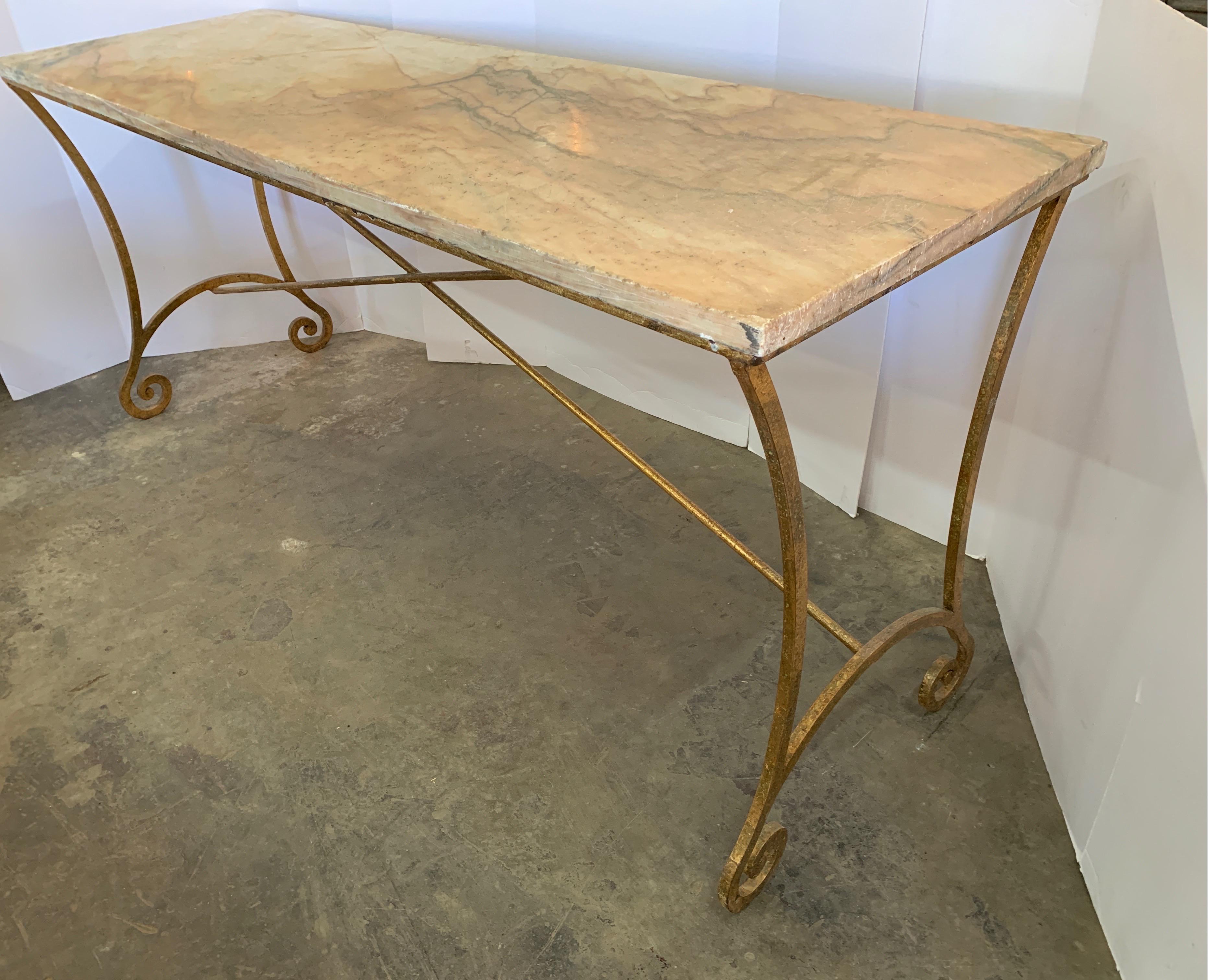 This is a great console for either outdoor patio or inside your home. The gold iron gives it a dressy finish and the antique marble adds to it's character. It originates from Spain.
