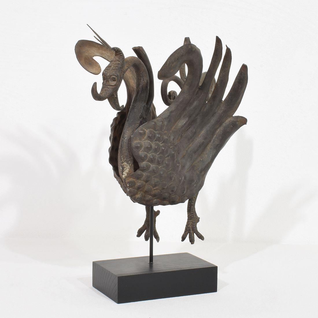 Great hand forged iron bird ornament. Was once part of a larger item.
Weathered. Spain circa 1850
Measurements include the wooden base.