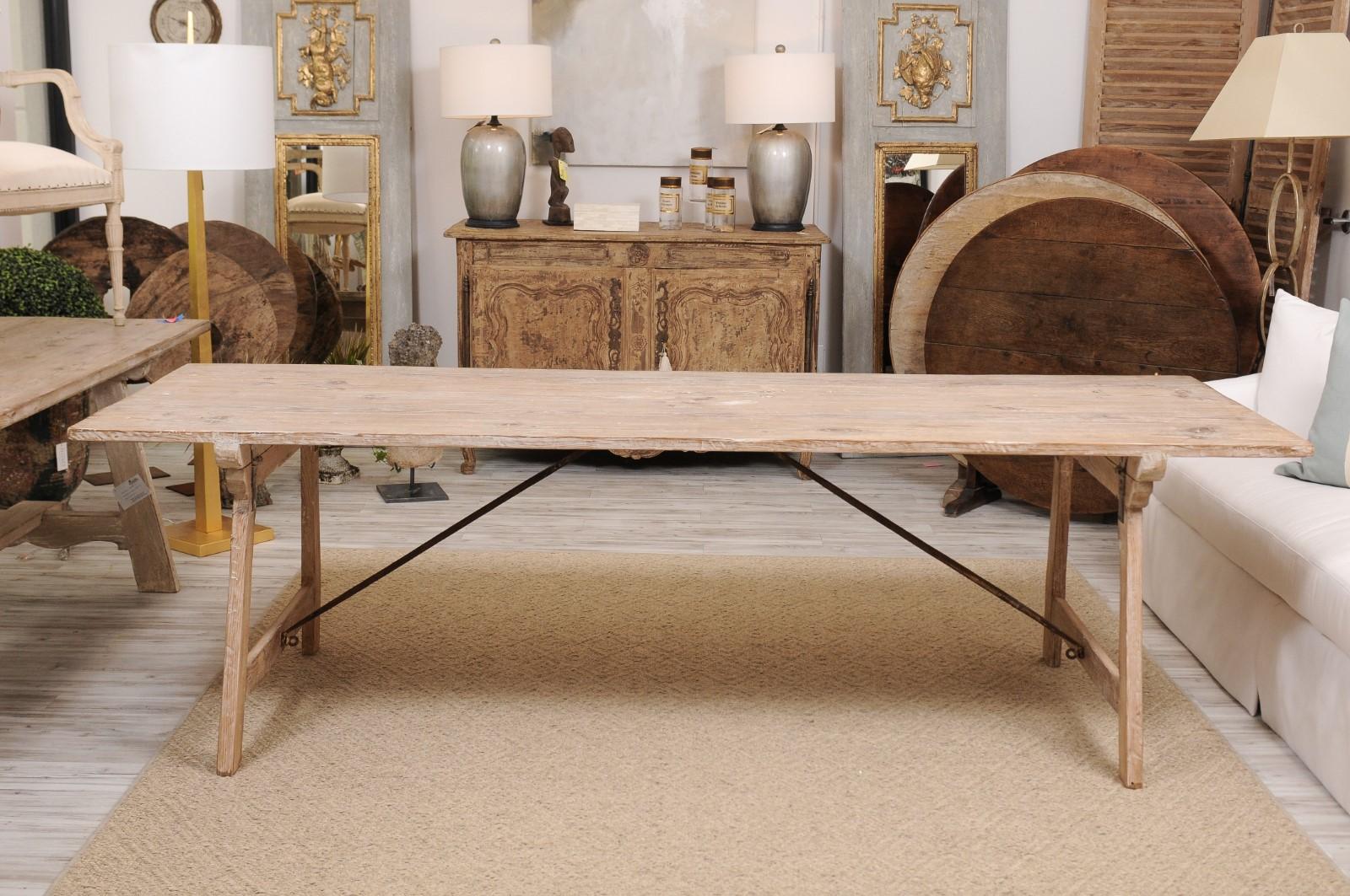 Rustic Spanish 19th Century Refinished Farm Table with Trestle Base and Iron Stretchers