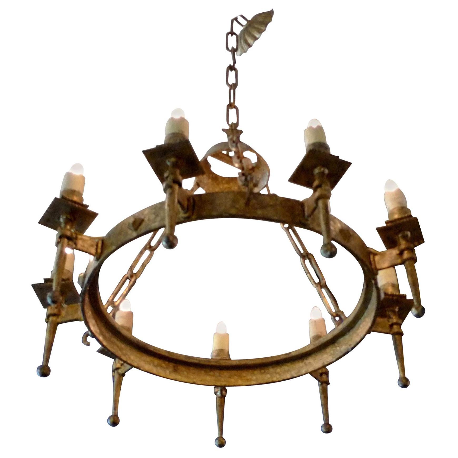 Spanish 19th century round gilded iron chandelier with nine outer lights.