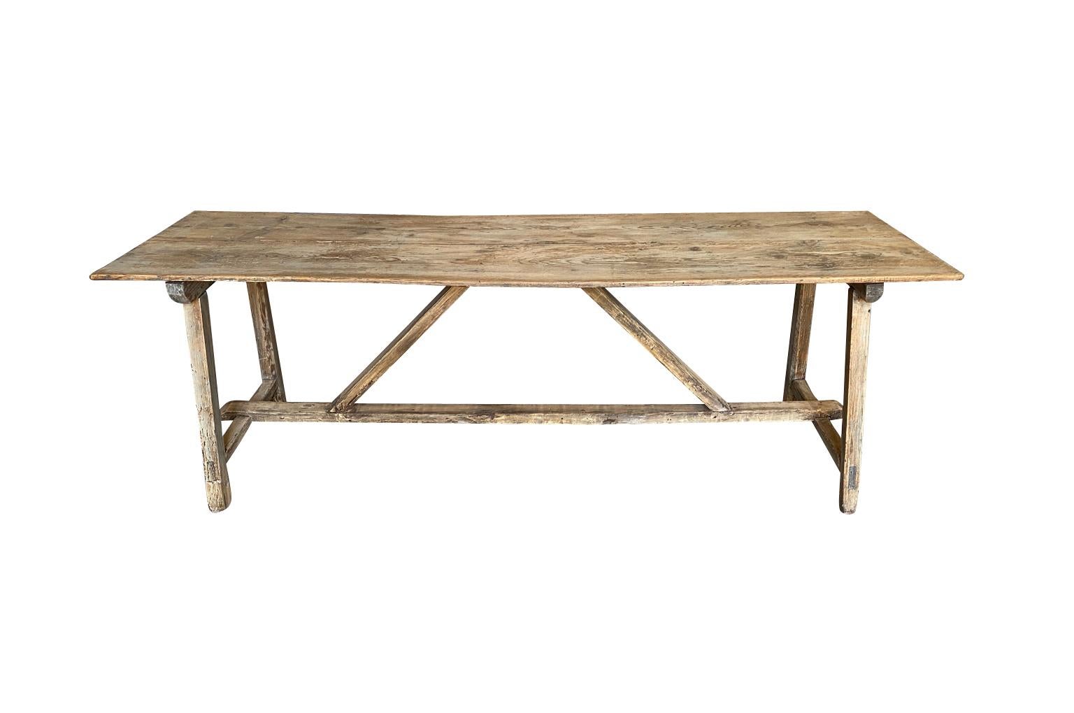 A very charming rustic table from the Catalan region of Spain. Soundly constructed from Meleze - a very hard pine. Terrific patina. Serves beautifully as a console table or intimate dining table.