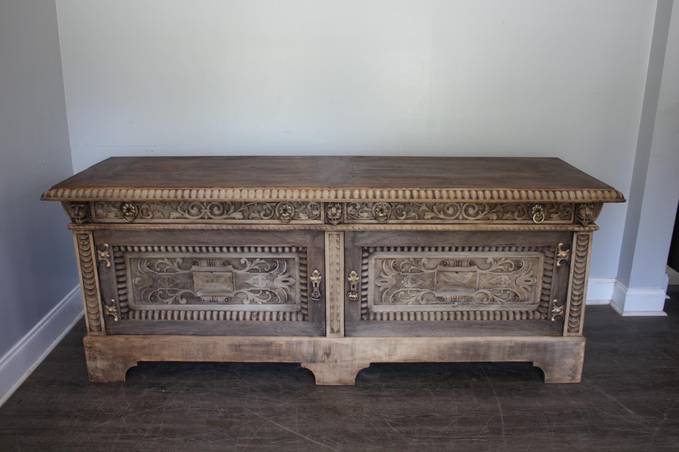This magnificent sideboard comes from the border of Spain and France. Rich with its carvings, it is just stunning.