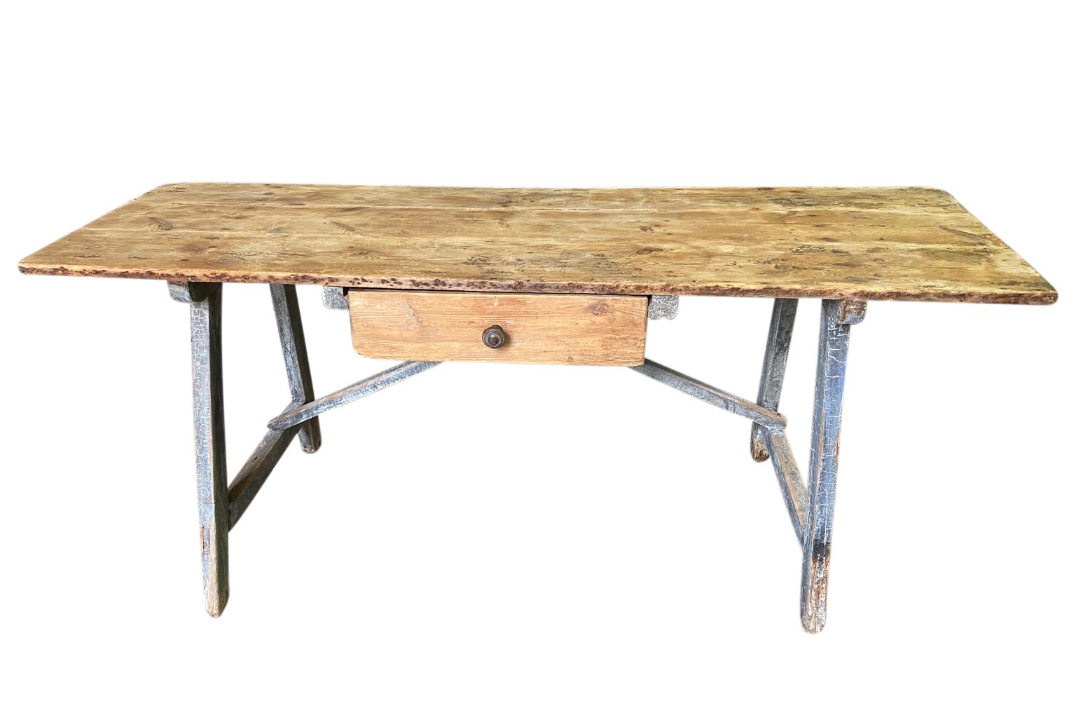 A charming later 19th century Writing Table - Desk from the Catalan region of Spain.  Soundly constructed from natural and painted pine with a single drawer, 