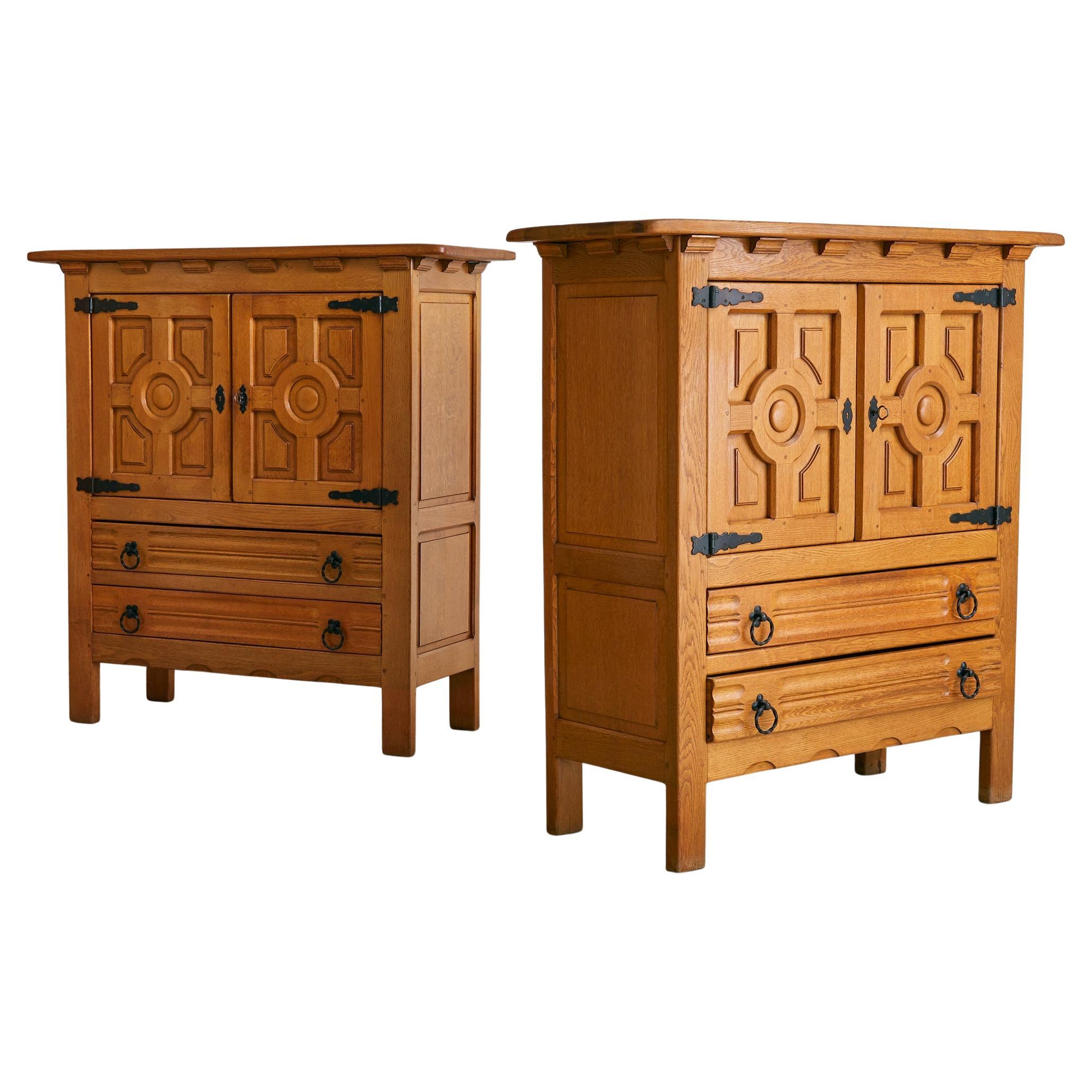 Sold and priced individually.

A robust and richly detailed solid oak cabinet, crafted in Spain during the 1940s. The double-door façade features deeply carved geometric panels — a nod to Spanish Renaissance motifs — lending the piece an