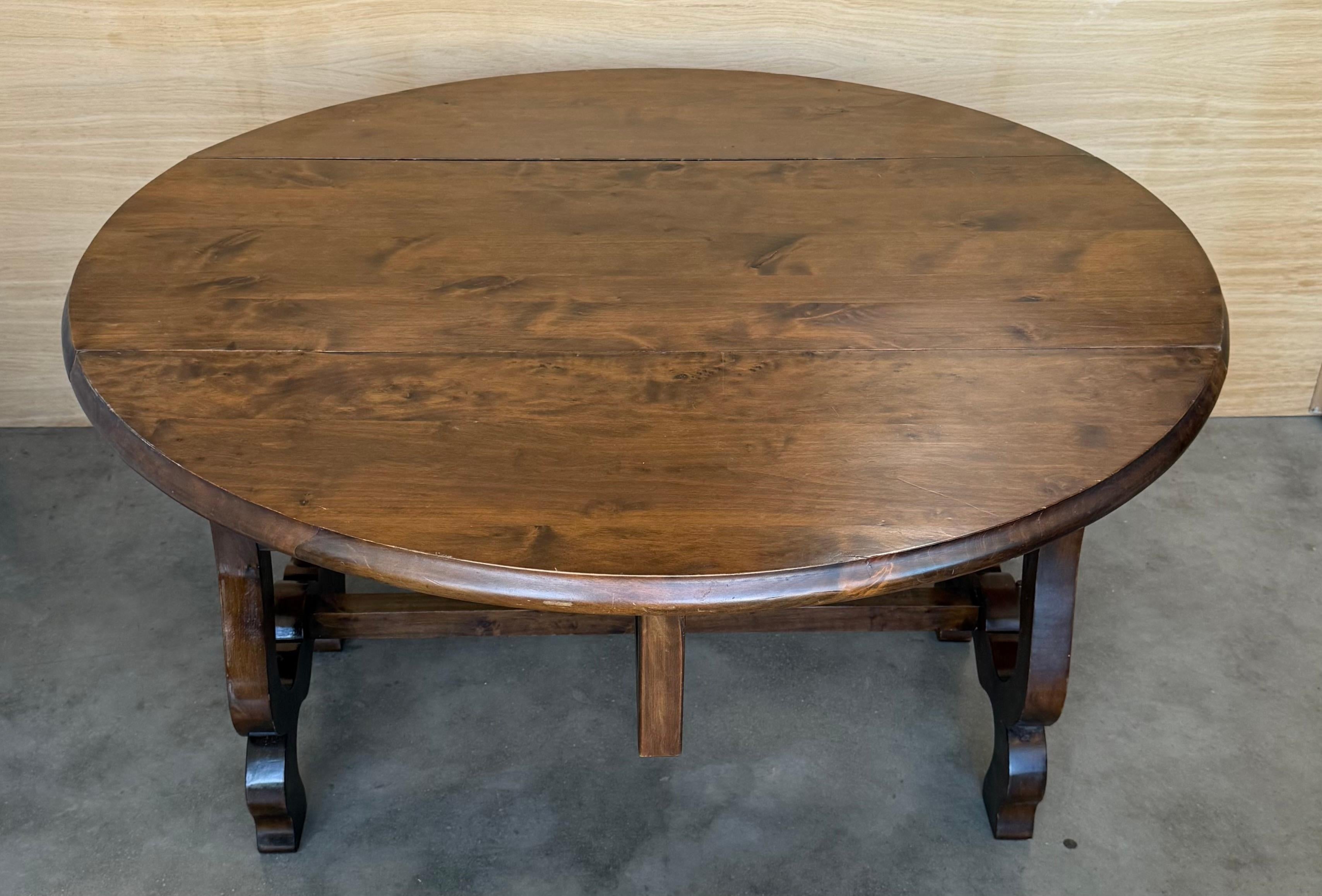 Spanish Colonial Spanish 20th Century Walnut Drop-Leaf Table with round Top and Lyre Legs For Sale