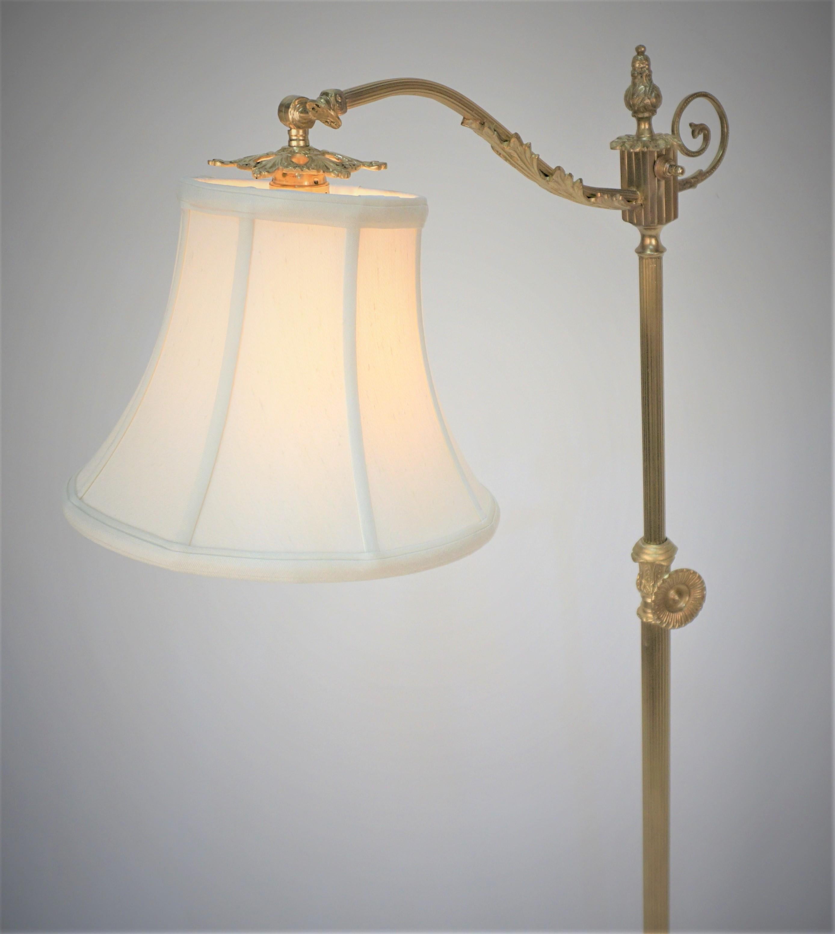 Elegant Spanish adjustable height bridge bronze floor lamp with silk lampshade.
Maximum height 63