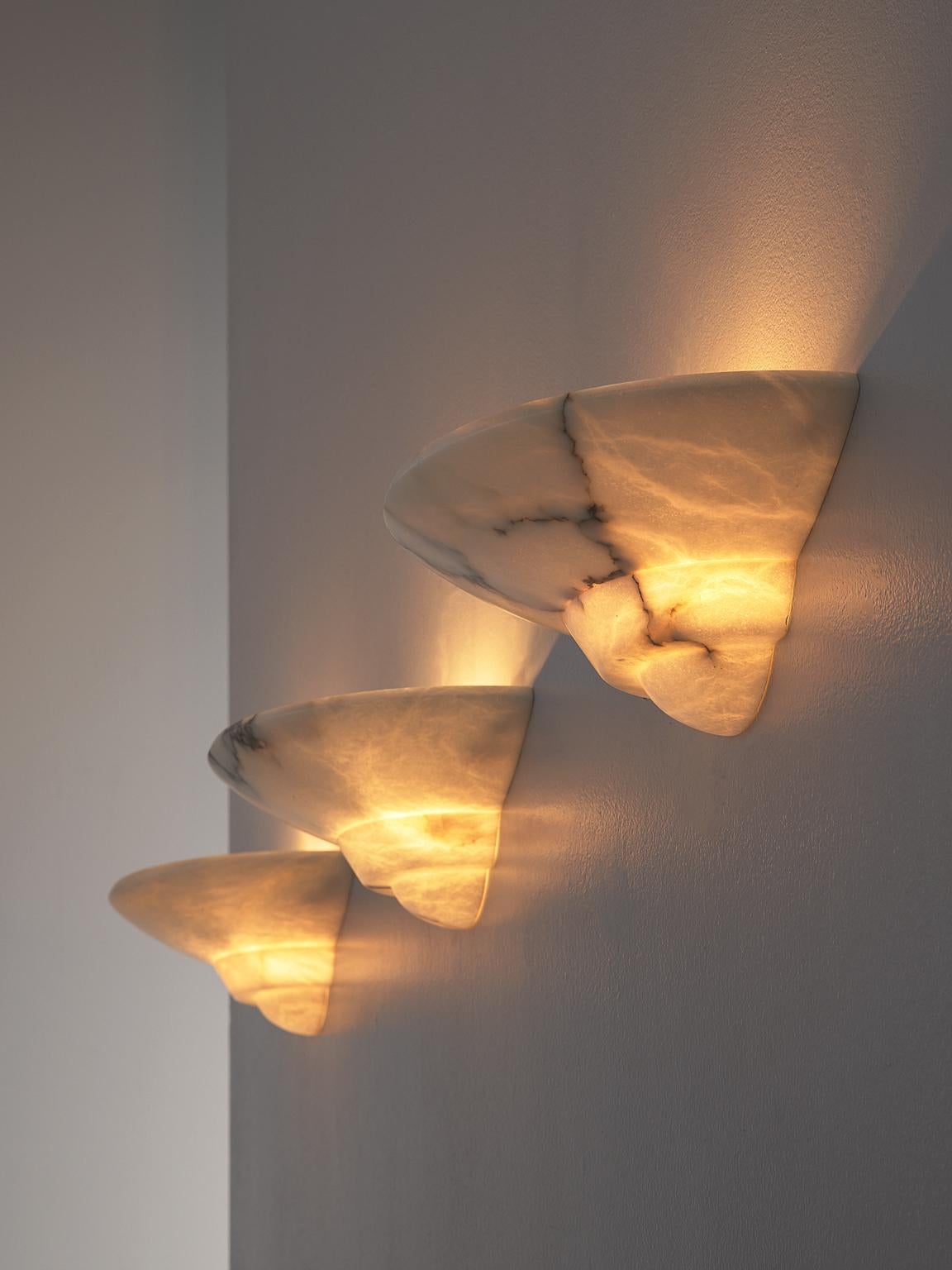Sarreal Art, wall lights, alabaster, Spain, 1970s

Set of very elegant sconces by Sarreal Art, designed in the late 1970s. The sconces are made of alabaster, which results in a beautiful range in shades of light through the material. The light