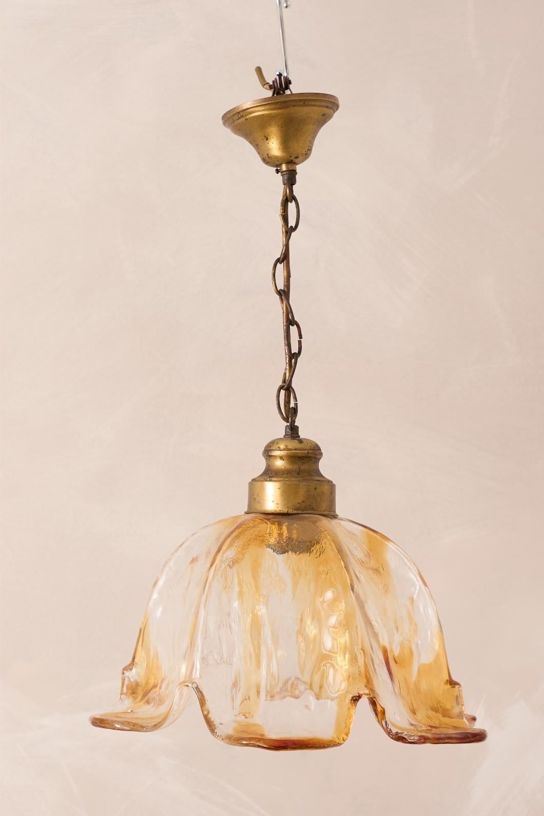 These are stunning mid century Spanish amber glass pendant lights in a tulip shape. All of these are in very good condition and are entirely hand blown. The size is very nice and each comes with the original gilt metal gallery.
Can be wired to any