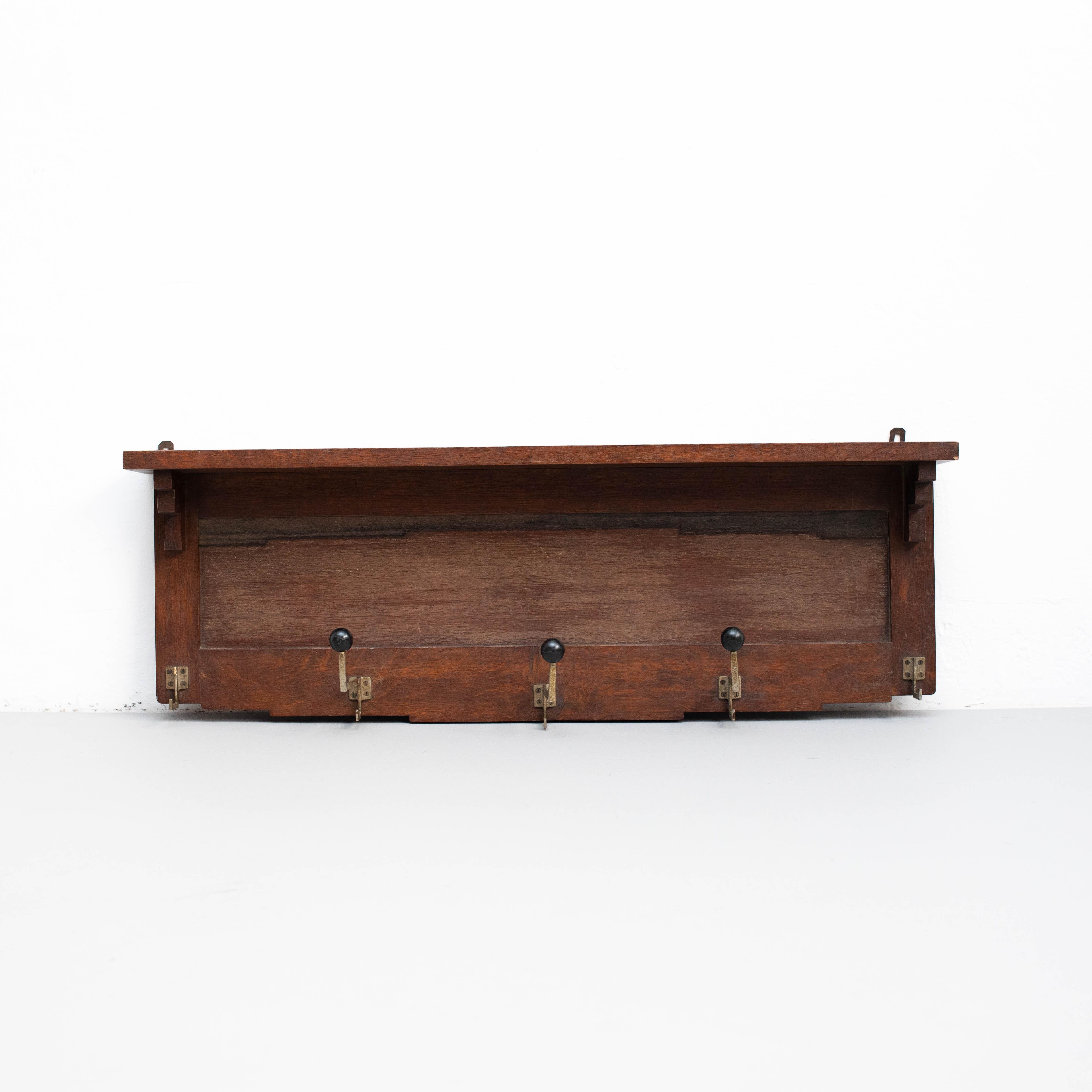 Antique traditional rustic wood hanger.
By unknown artisan from Spain, circa 1960.

In original condition, with minor wear consistent with age and use, preserving a beautiful patina.

Materials:
Wood

Dimensions:
H 14cm 
W 40cm
D 4cm.