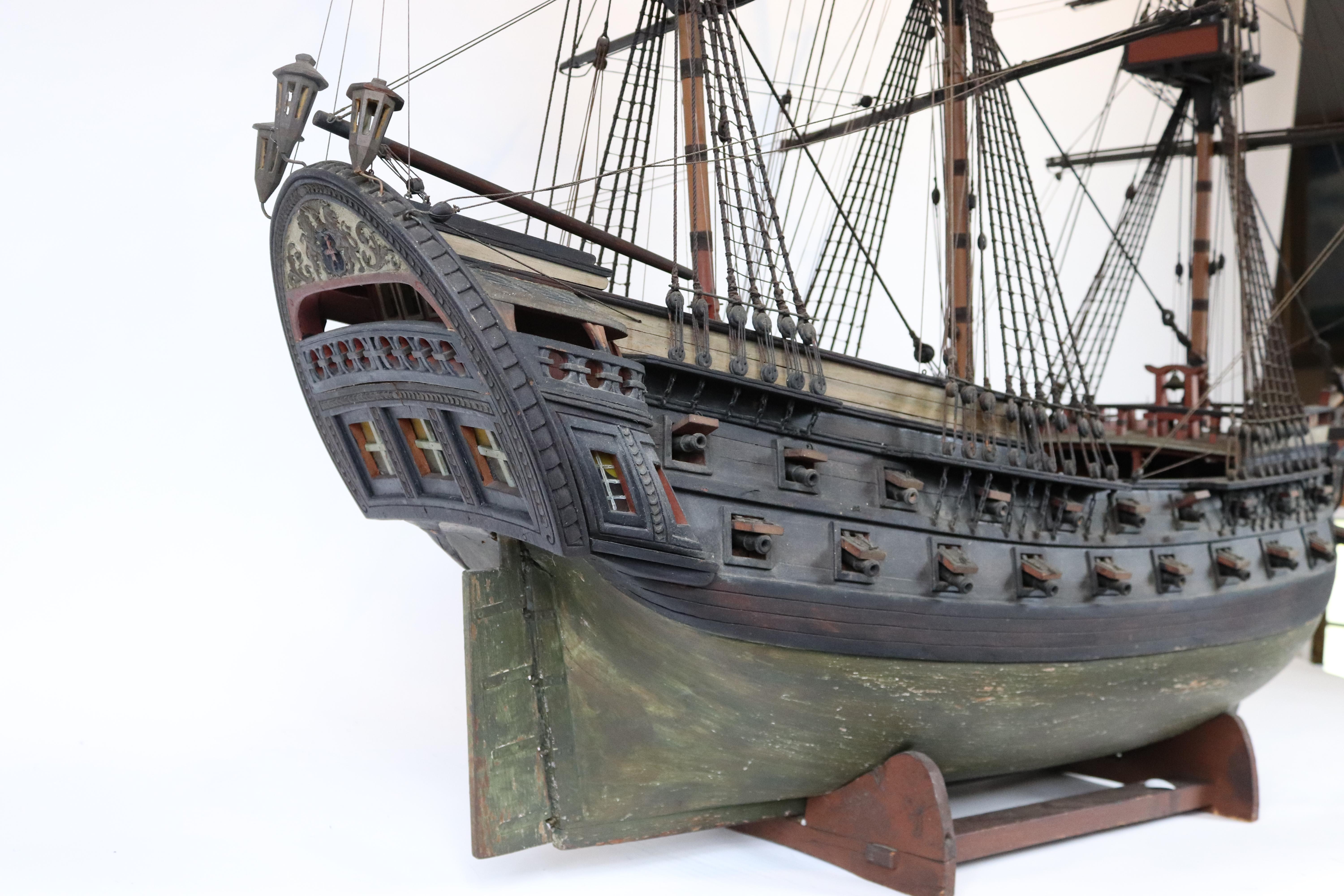 Large antique Spanish Armada-style model. Johnny Depp needs this model because it so resembles the black pearl. Awesome stern galleries and figurehead. Model carries forty guns on carriages. With wood cradle. Measure: 62