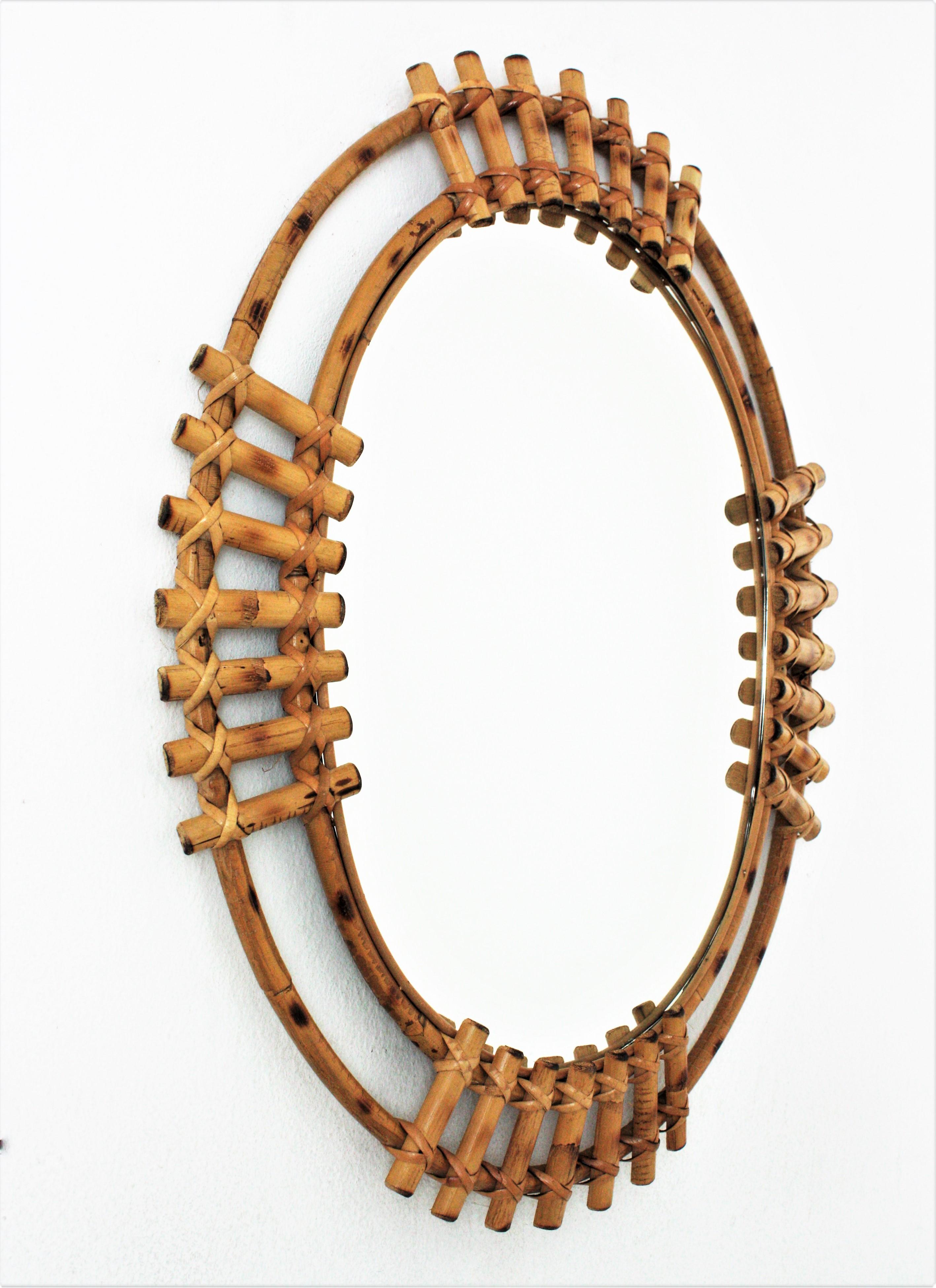 Mid-Century Modern Spanish Bamboo Rattan Oval Sunburst Mirror, 1960s For Sale