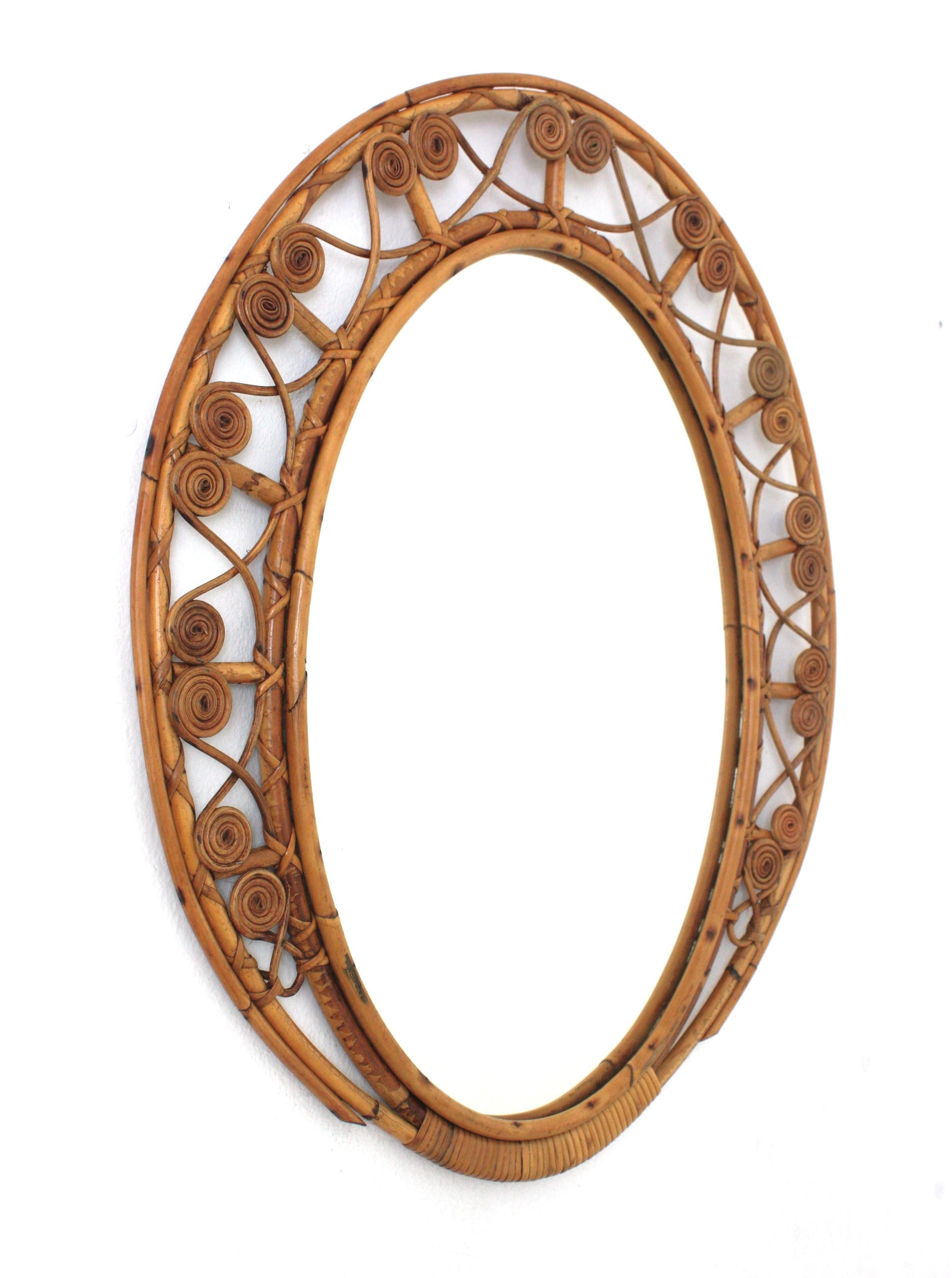Mid-Century Modern Spanish Bamboo Rattan Oval Mirror with Filigree Frame For Sale