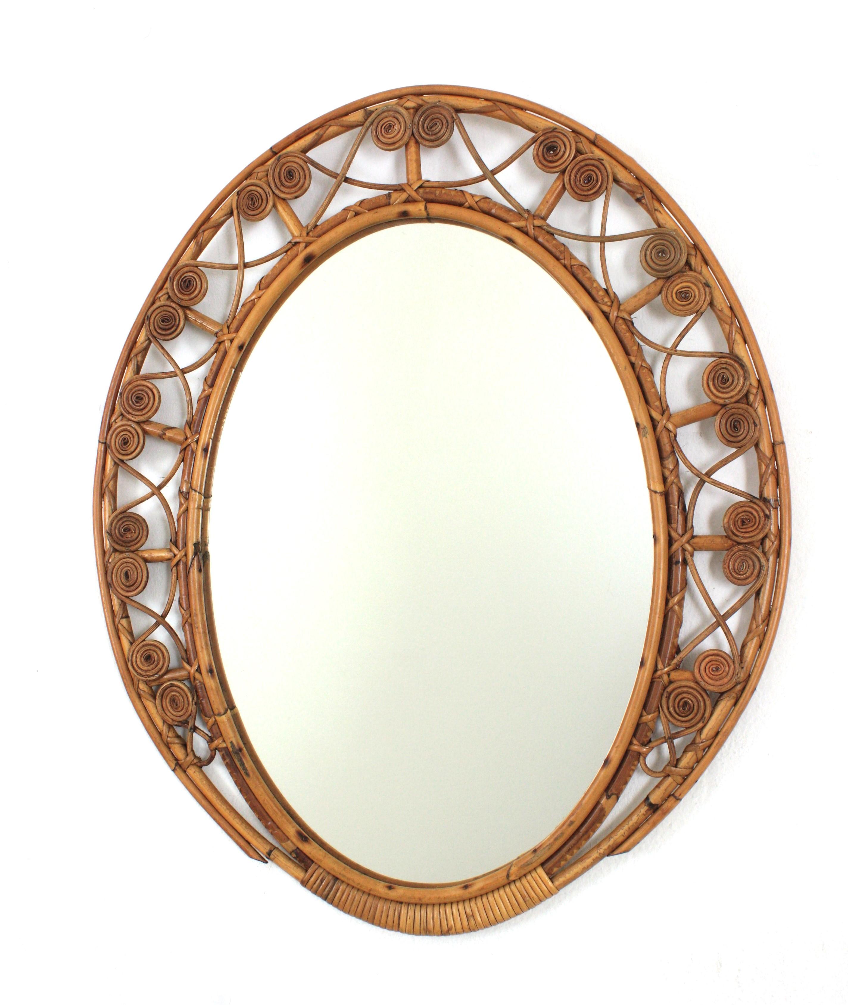 Cane Spanish Bamboo Rattan Oval Mirror with Filigree Frame For Sale