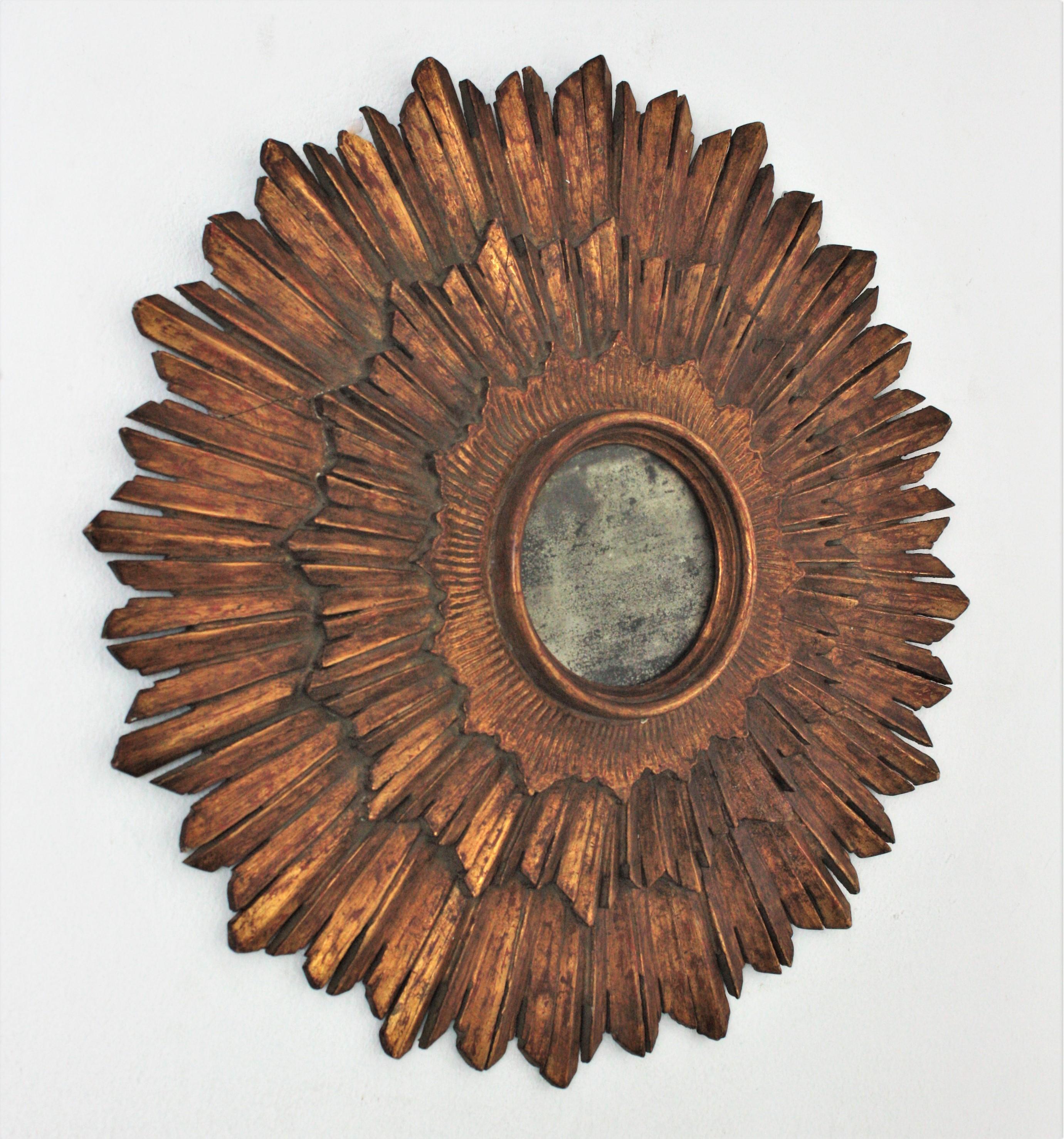 Hand-Carved Spanish Baroque Sunburst Mirror in Carved Giltwood For Sale
