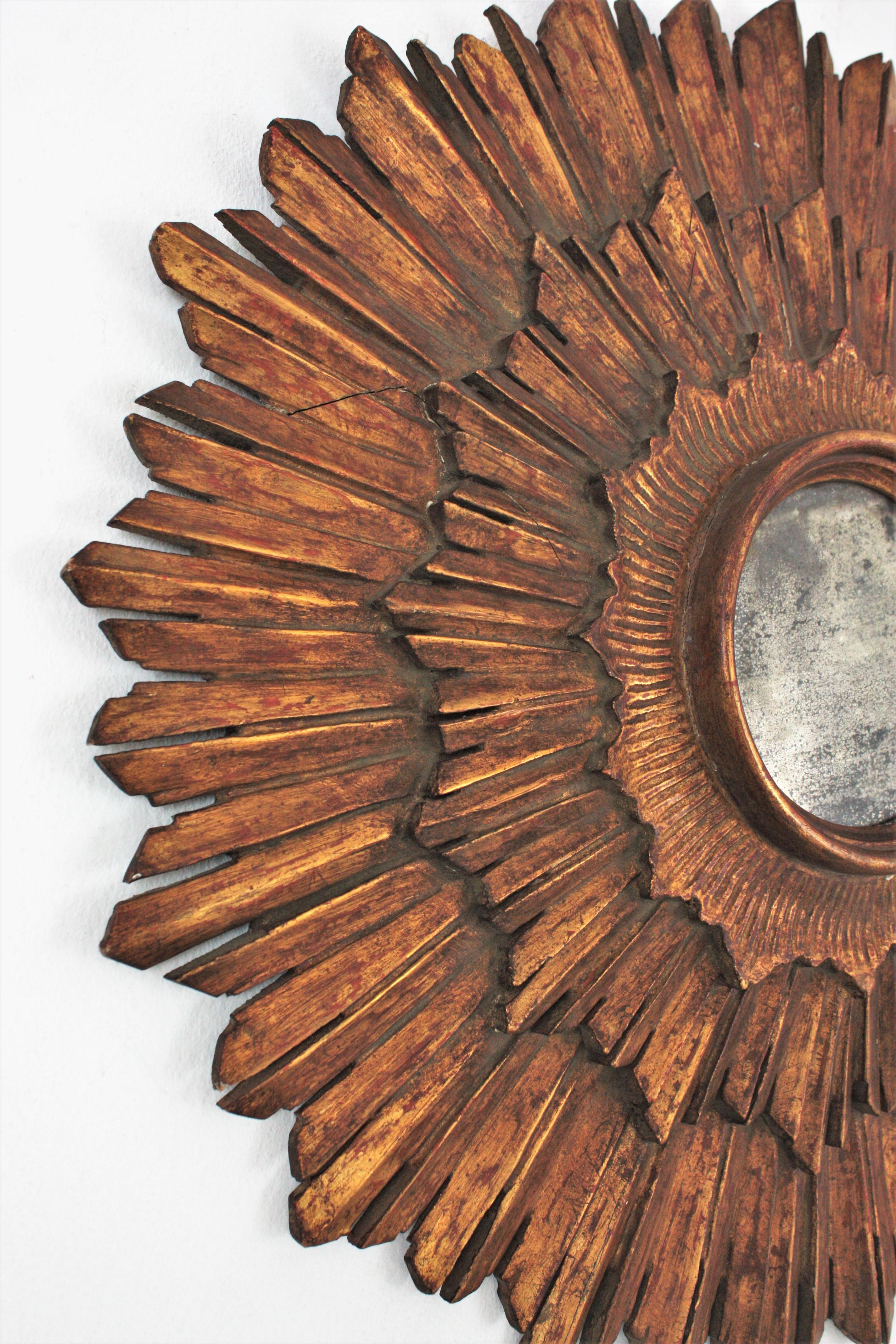 Gesso Spanish Baroque Sunburst Mirror in Carved Giltwood For Sale
