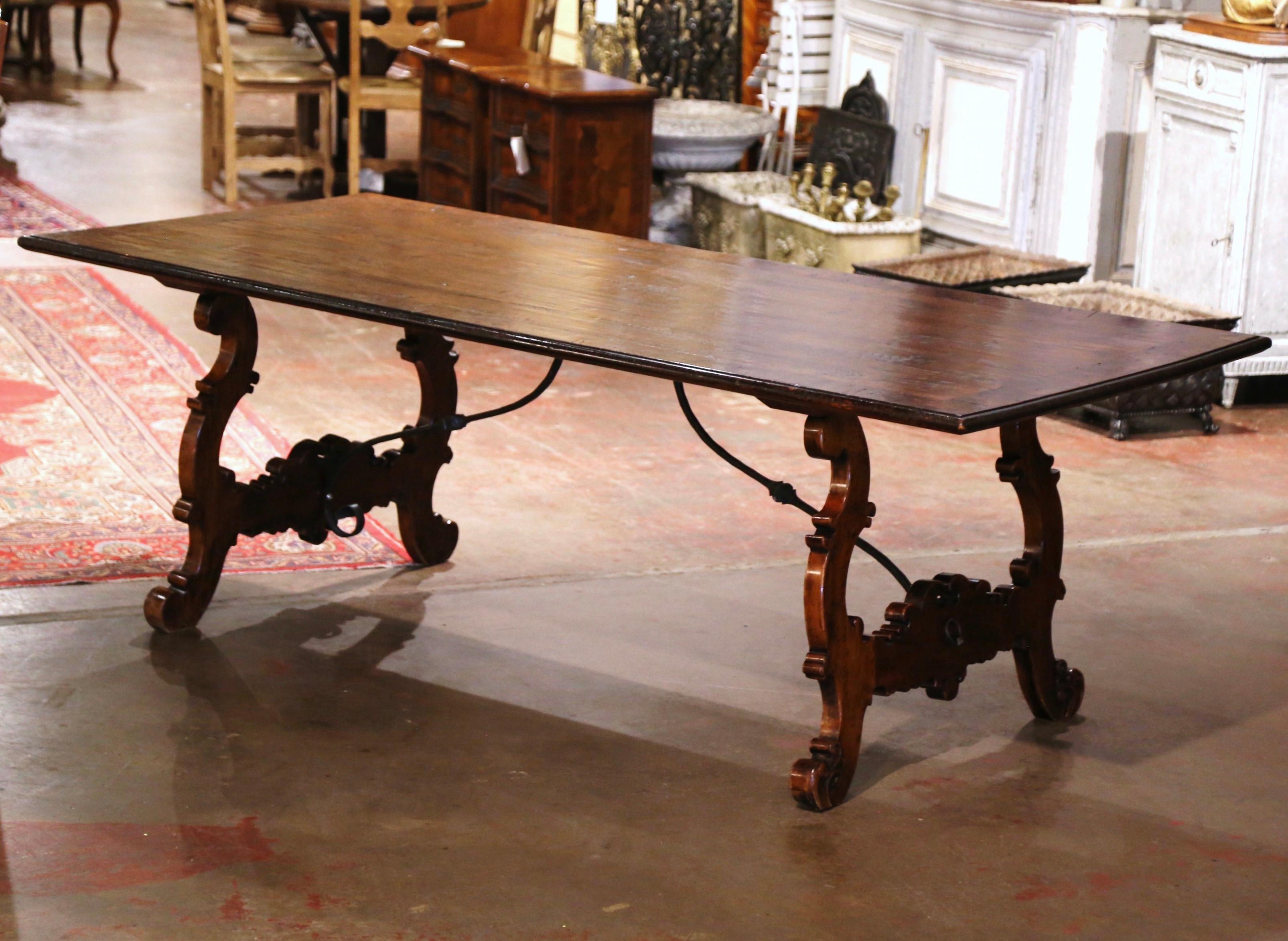 Spanish Baroque Carved Walnut and Burl Dining Trestle Table with Iron Stretcher In Excellent Condition In Dallas, TX