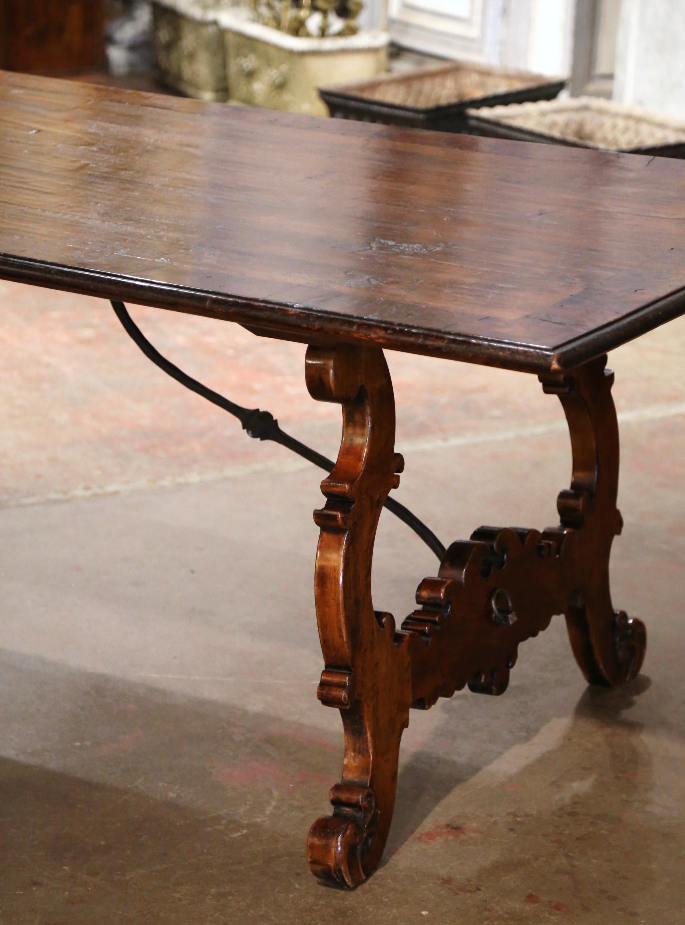 20th Century Spanish Baroque Carved Walnut and Burl Dining Trestle Table with Iron Stretcher