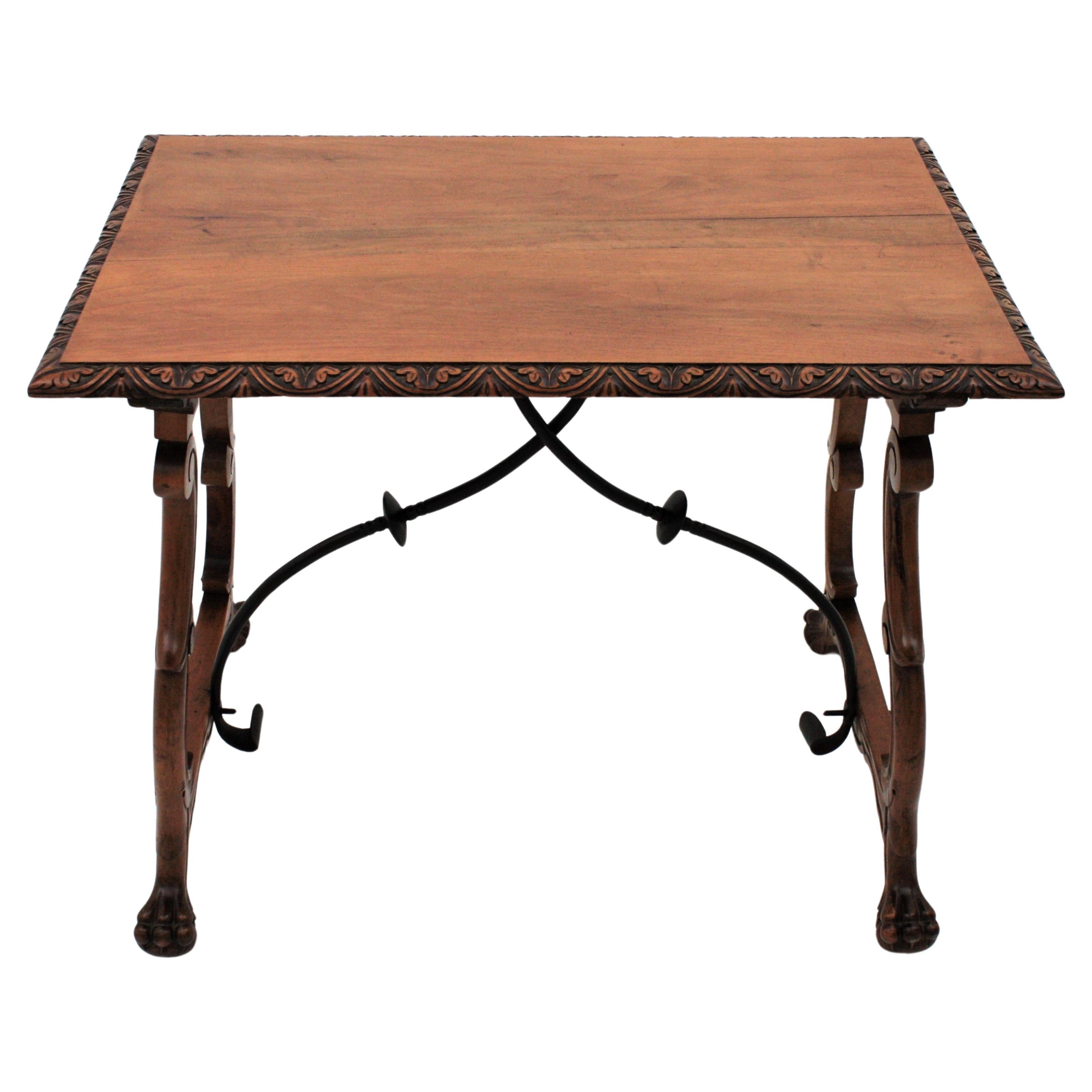 Spanish Colonial Baroque walnut lyre-leg fratino table with iron stretcher
Exquisite antique hand carved lyre-leg walnut wood Fratino trestle table with iron stretchers.
This gorgeous Fratino table features a rectangular top with beautifully carved