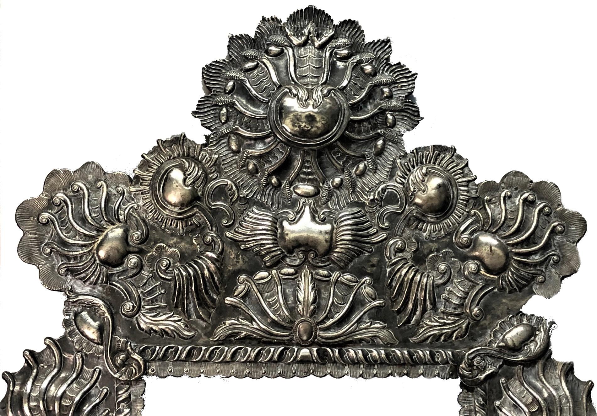 ABOUT FRAME
Handmade during 17th century, this frame is a grandiose piece of master craft by an extraordinary Spanish silversmith. Exceptionally complex, not only in its exquisite and elaborate design, but also with the use of several silver working