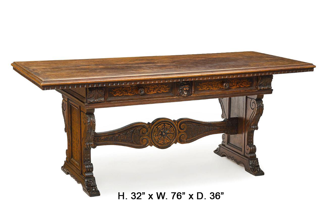 Impressive Spanish Baroque style stenciled marquetry carved oak trestle table,
19th century. 

A moulded rectangular top is above an intricately carved wooden frieze fitted with two faux marquetry decorated drawers, centered by a hand-carved