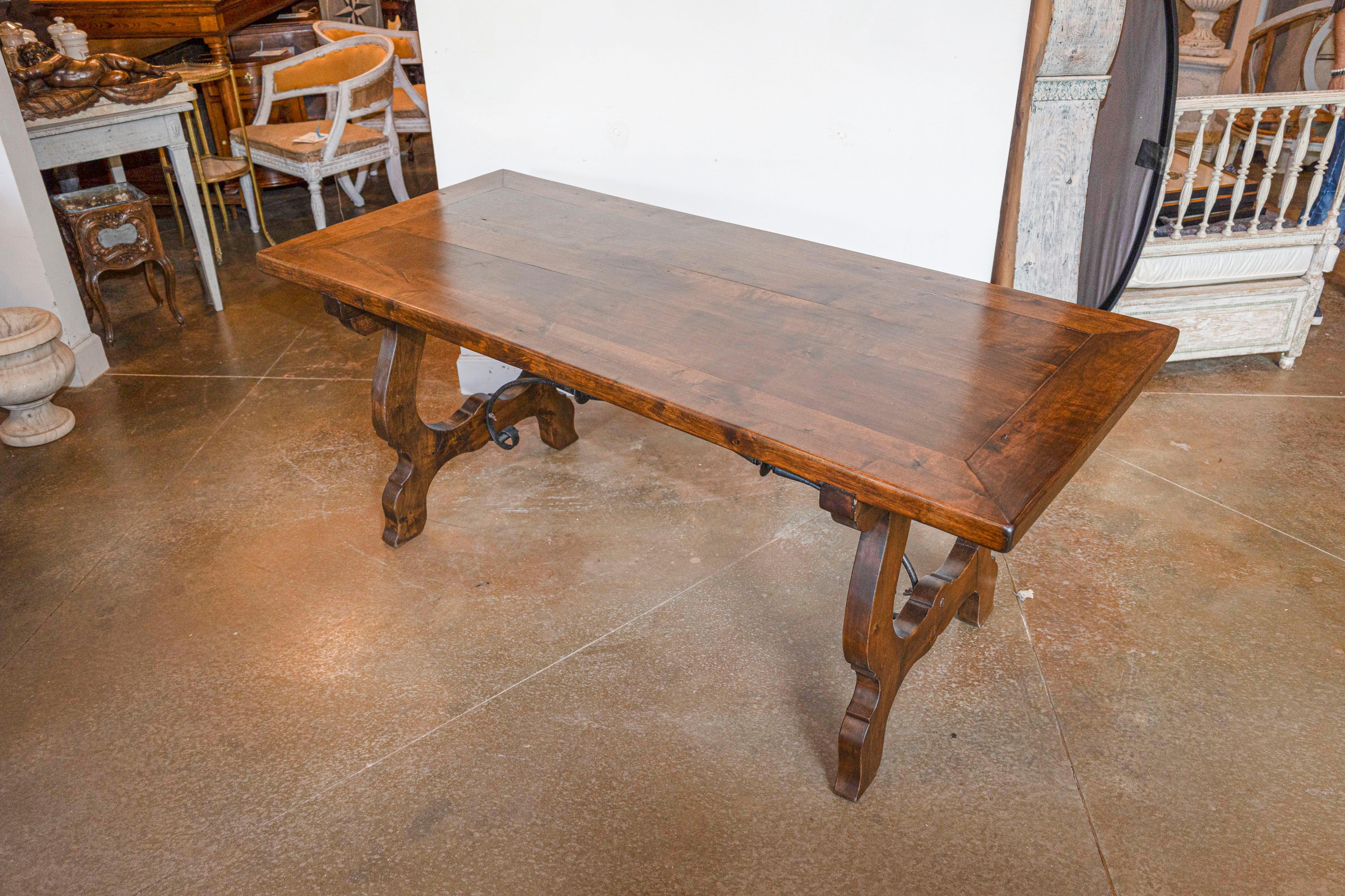 Carved Spanish Baroque Style Fratino Table with Lyre Shaped Base and Iron Stretcher