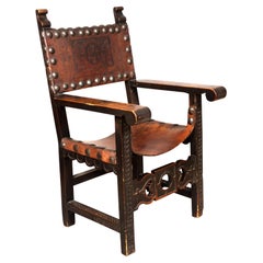 Sillón barroco español de nogal y cuero
