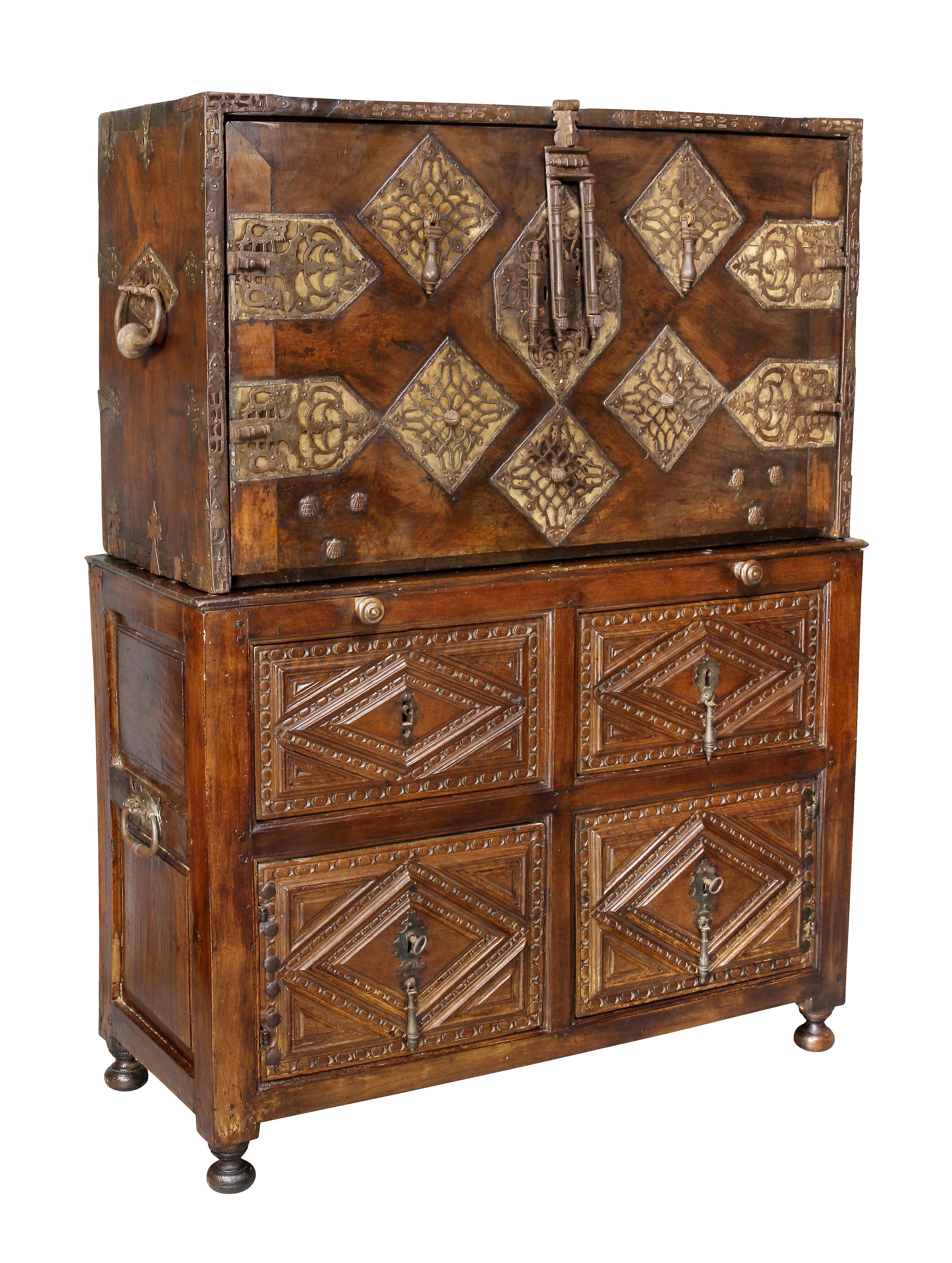 In two parts with upper section with fold down writing lid opening to an elaborately fitted gilded interior with drawers and compartments, the base with geometric panelled drawers, bun feet. Estate of John Volk, noted Palm Beach architect.