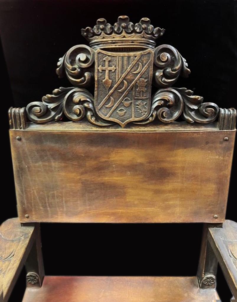 Spanish Baroque walnut armchair with crown and coat of arm, Early 19c In Distressed Condition In Cypress, CA