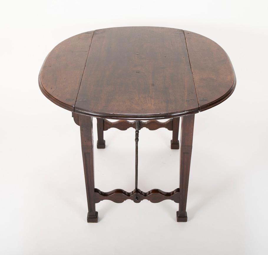 Spanish Baroque Walnut Drop Leaf Table with Wrought Iron Stretchers For Sale 5