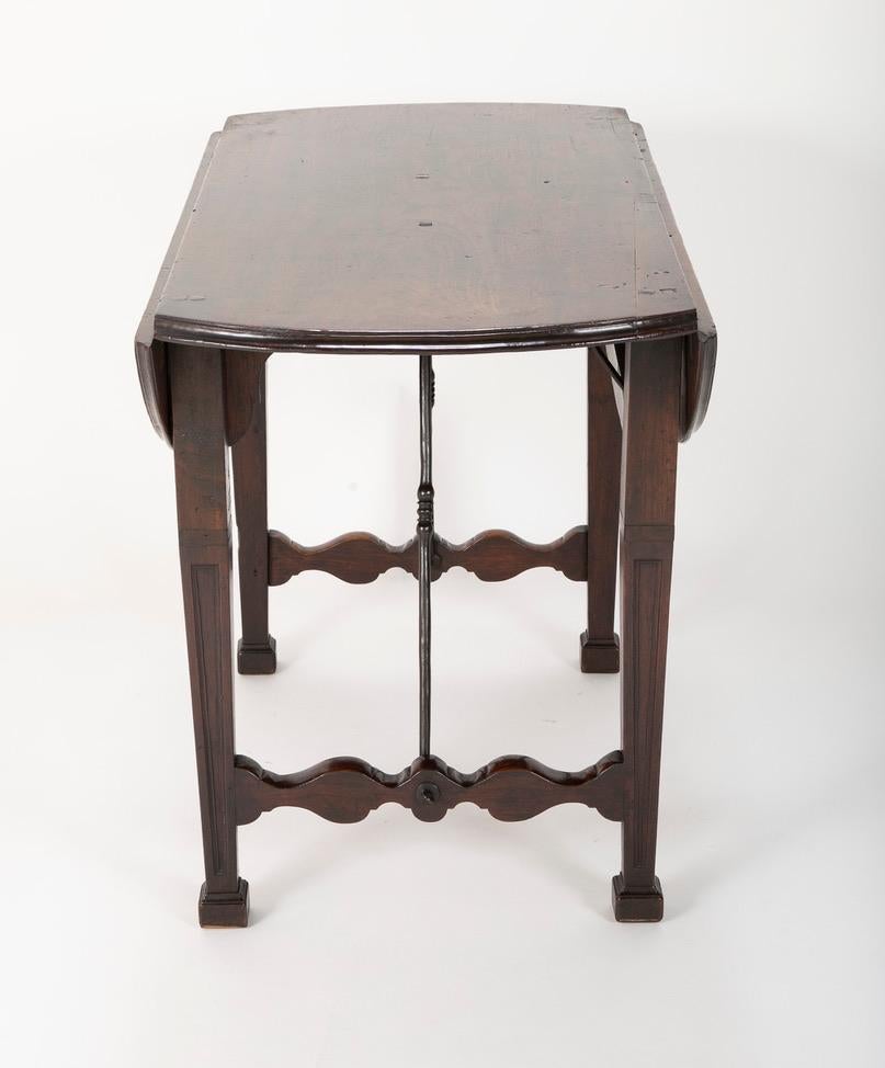 Spanish Baroque Walnut Drop Leaf Table with Wrought Iron Stretchers For Sale 1