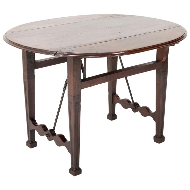 Spanish Baroque Walnut Drop Leaf Table with Wrought Iron Stretchers For Sale