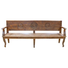 Spanish Bench with Wooden Arms with Hand-Carved Head Decorations