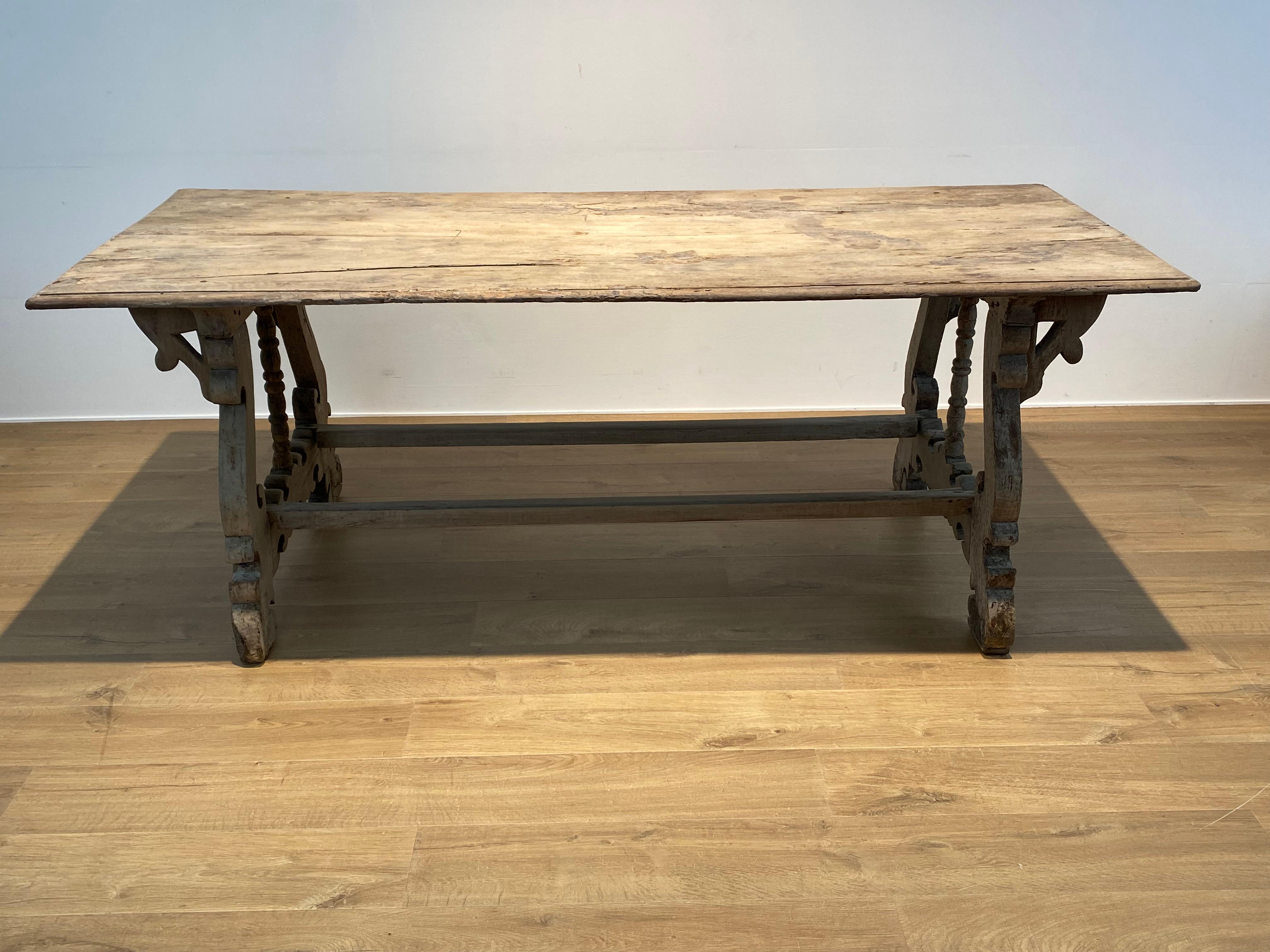 Exceptional   Antique Spanish Catalan Table in a Bleached Chestnut,
from around 1890,
beautiful aged patina and shine of the wood,
elegant and Baroque feet with 2 stretchers,
powerful piece of furniture that can be used for different purposes