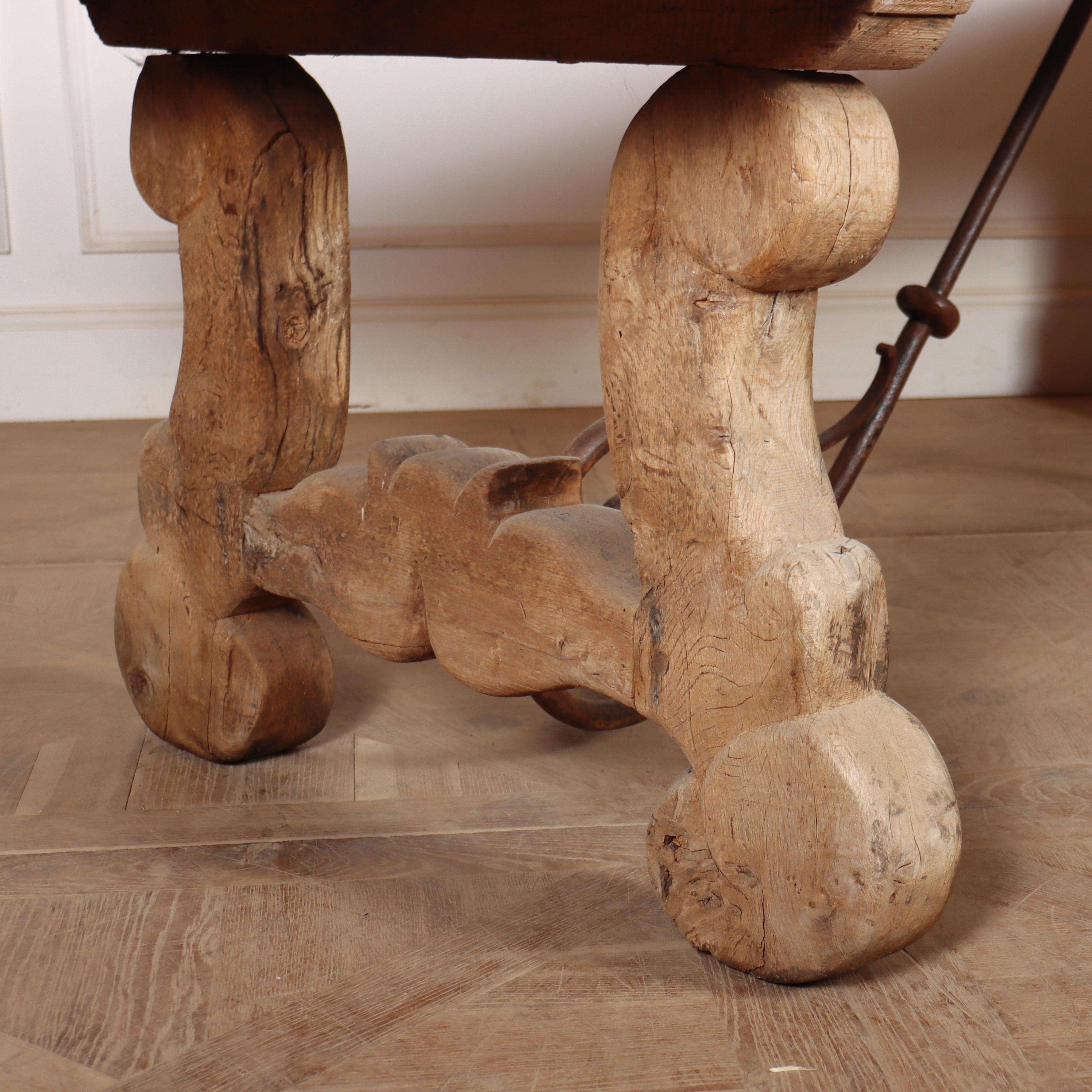 Monumental Spanish bleached oak dining table with a 9cm thick top and shaped iron stretcher. 1840.

Code: 8528

Dimensions:
W: 97.5