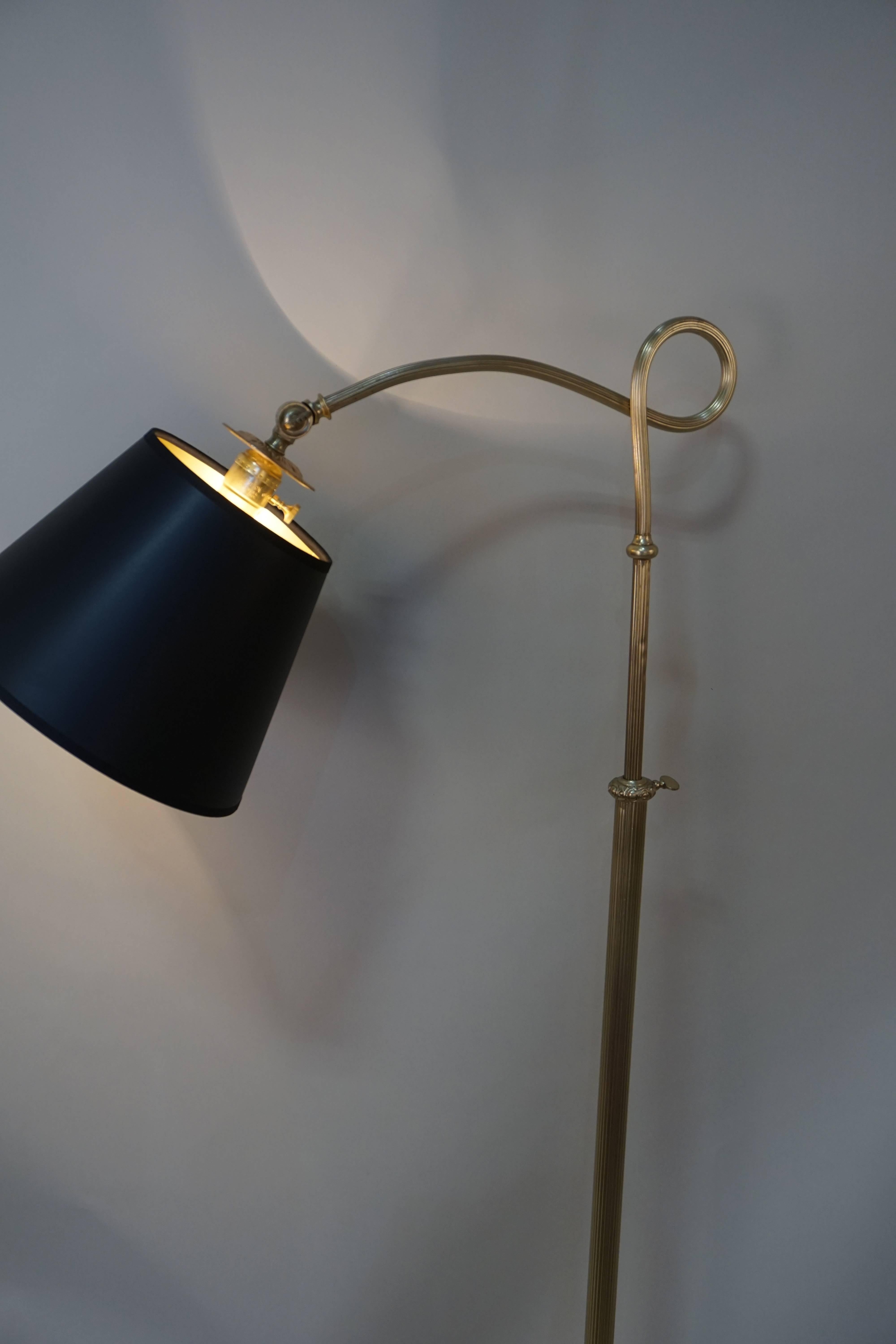 Made in Spain during 1930s an adjustable height floor lamp fitted with hardback black lampshade with gold lining.
Height adjustment from 50